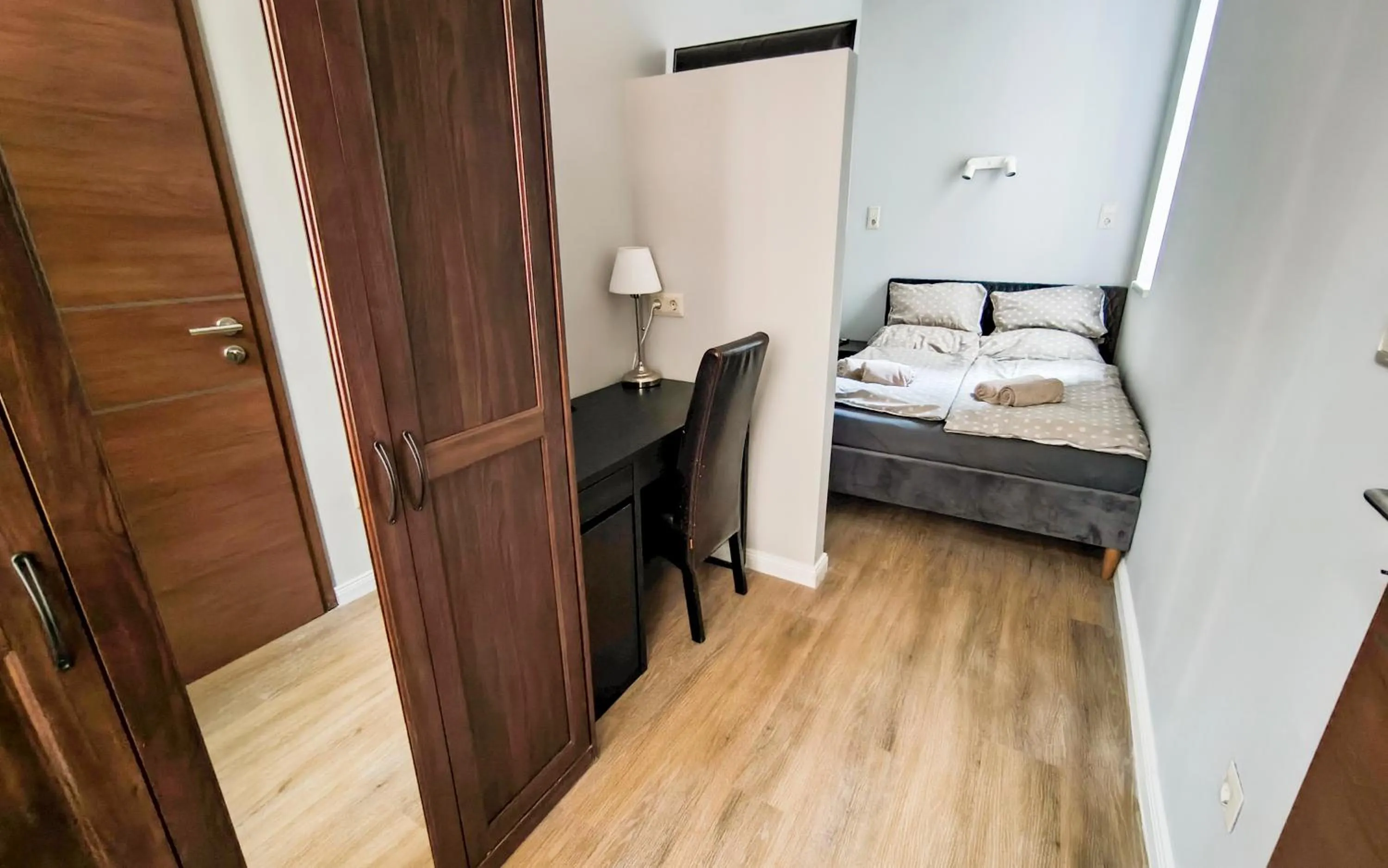 Bed in Corvin Point Rooms and Apartments