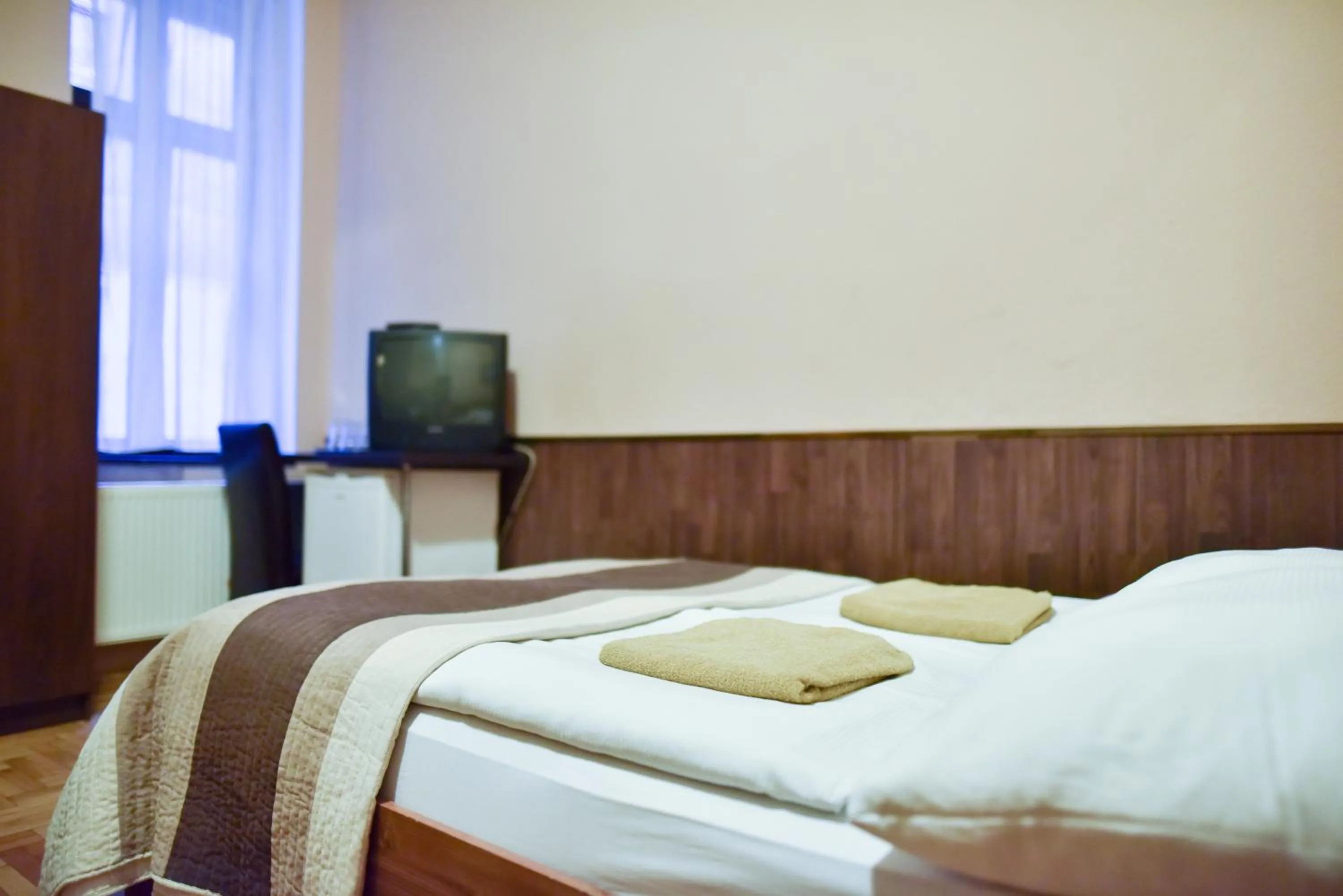 Bed in Corvin Point Rooms and Apartments