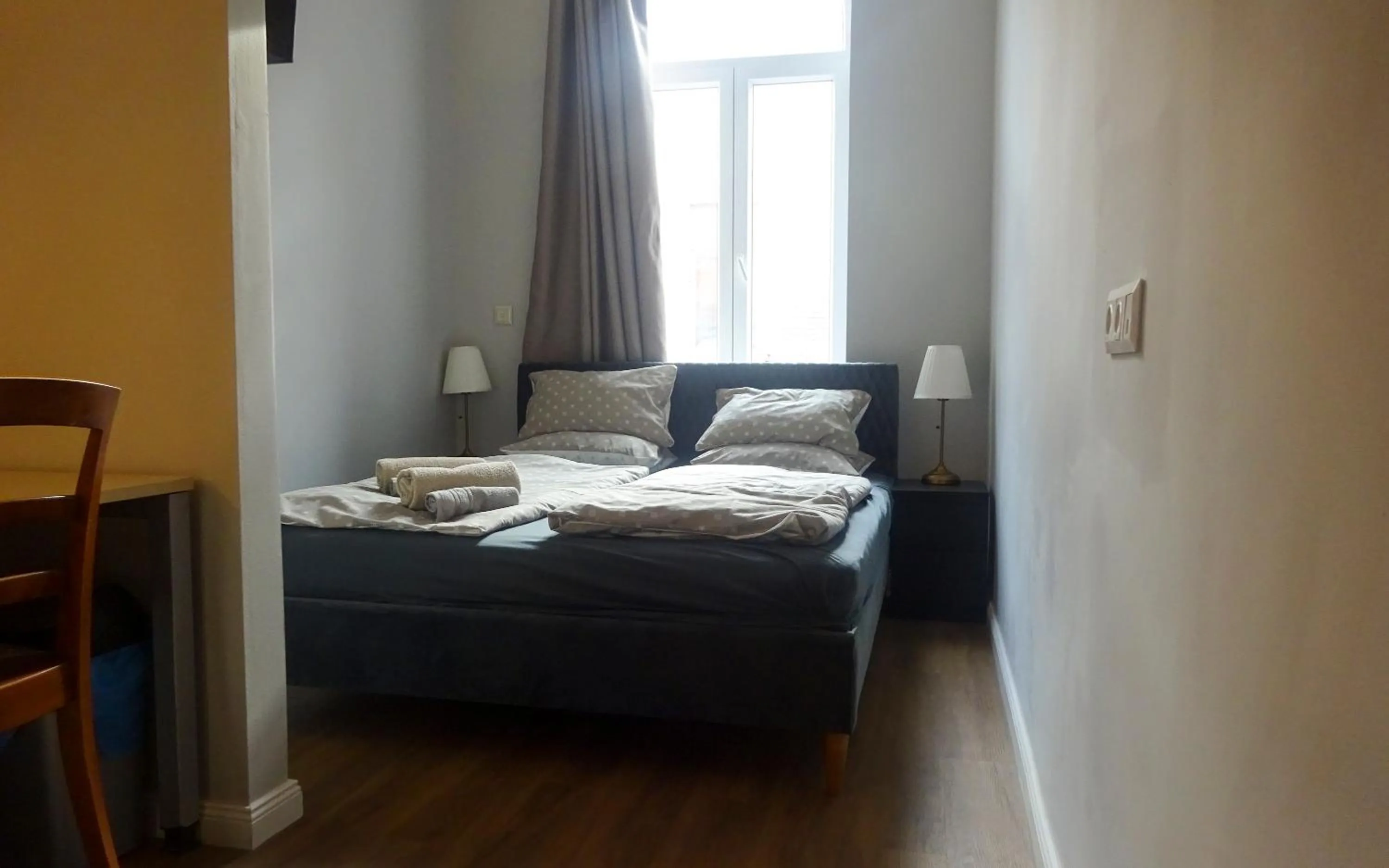 Bed in Corvin Point Rooms and Apartments