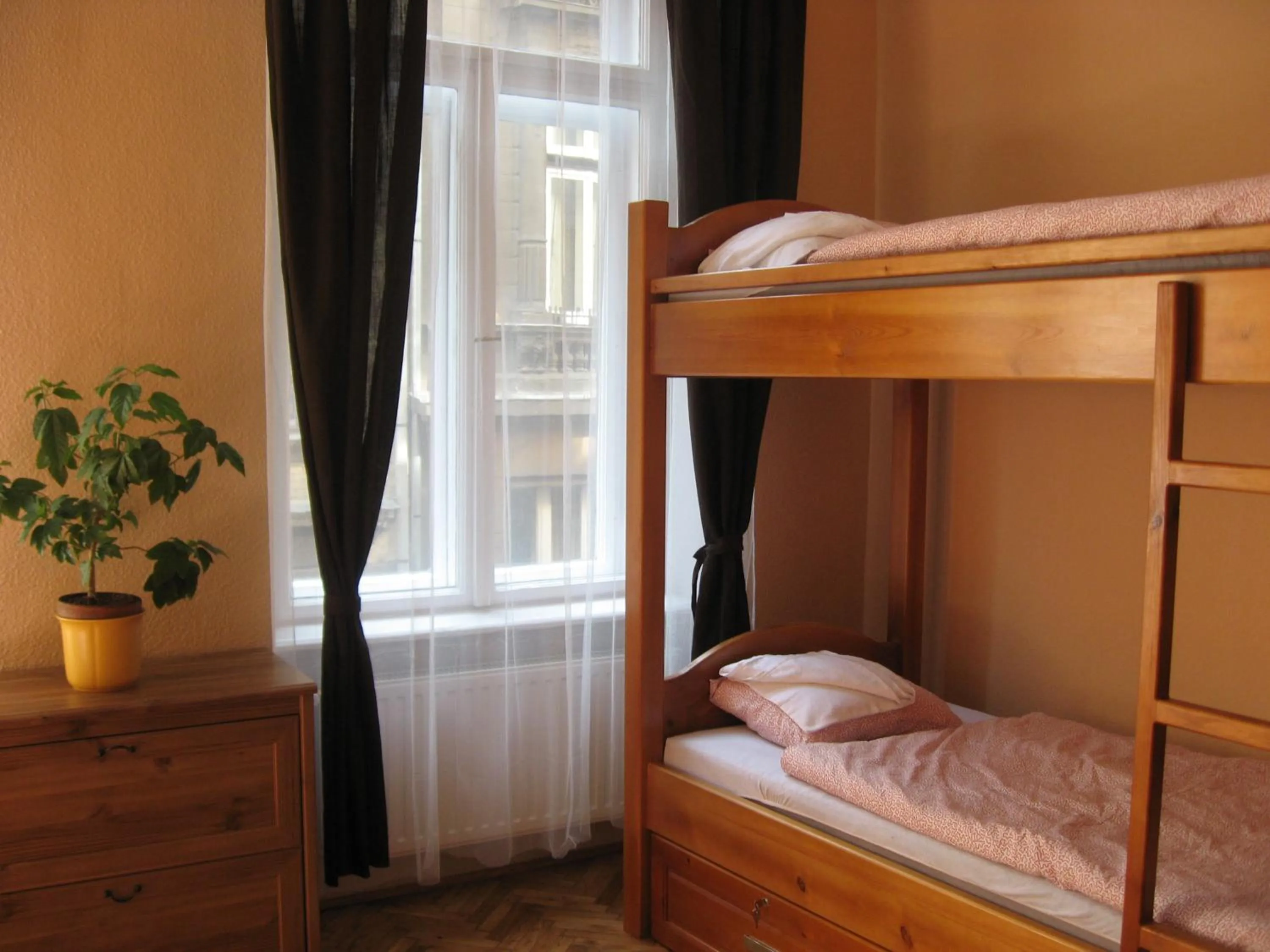 Bed in Corvin Point Rooms and Apartments