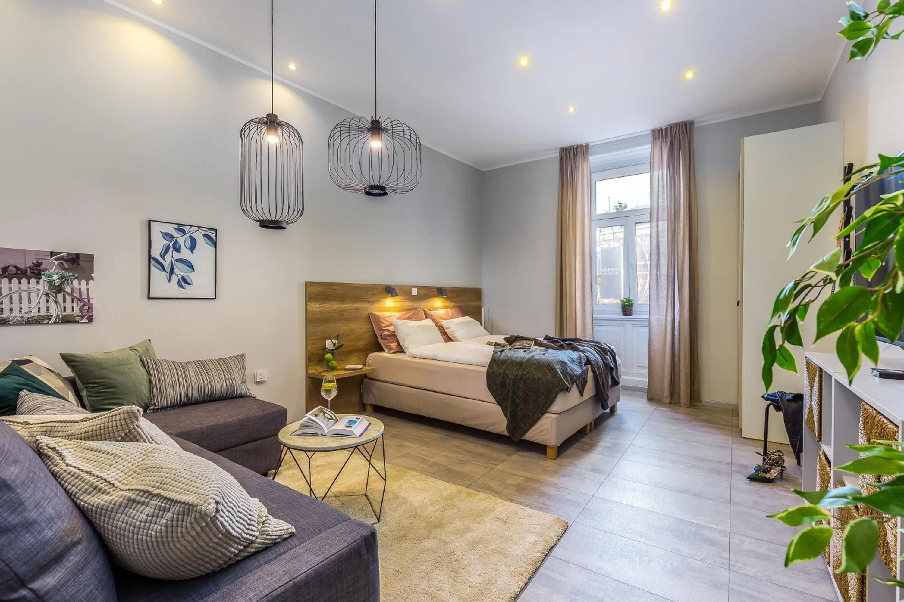 Living room, Bed in Number 1 Deluxe Apartments