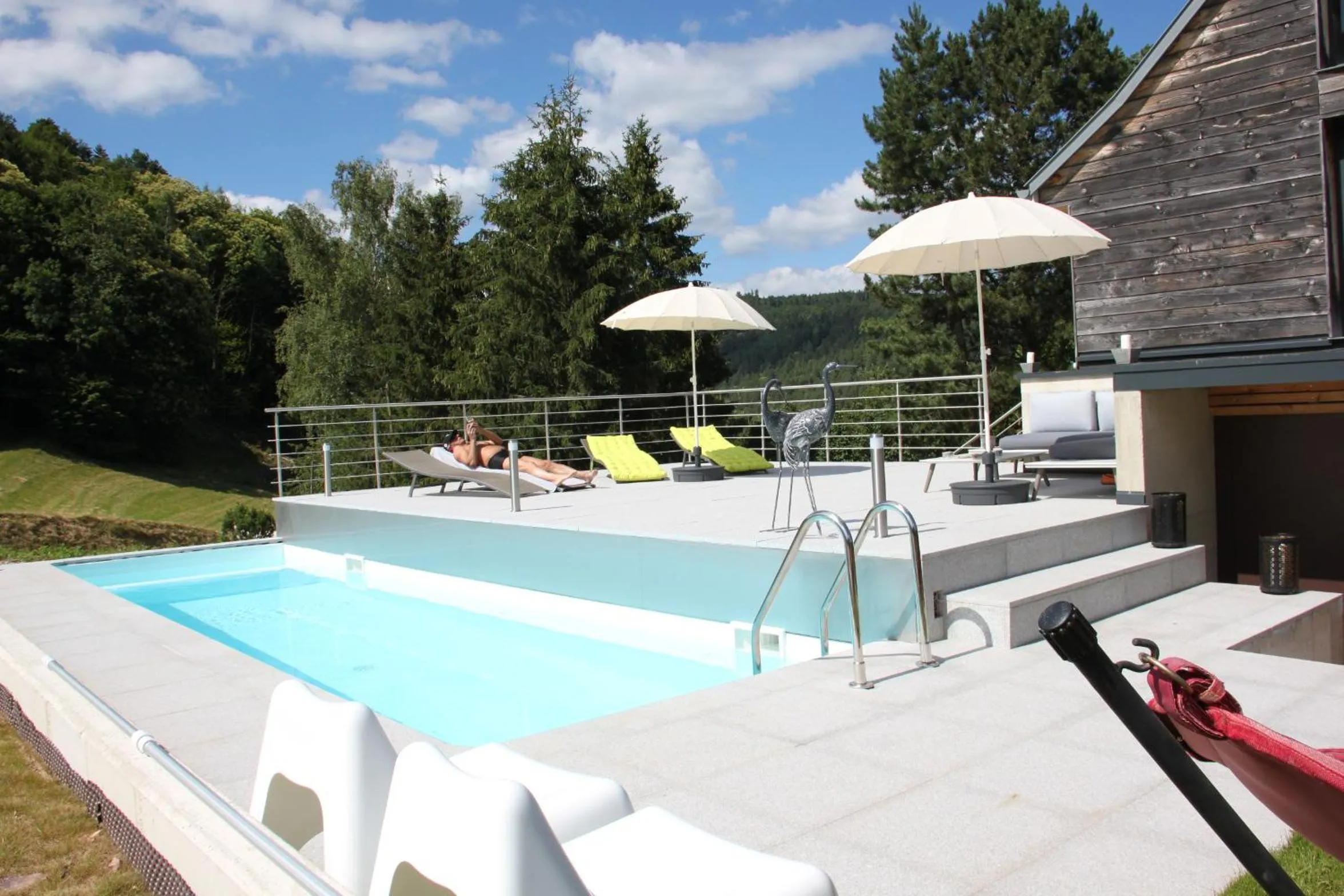 Communal lounge/ TV room in La Colline Du Baa - Maison d'hôtes d'exception