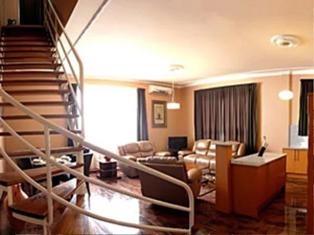 Communal lounge/ TV room in Sheva Hotel