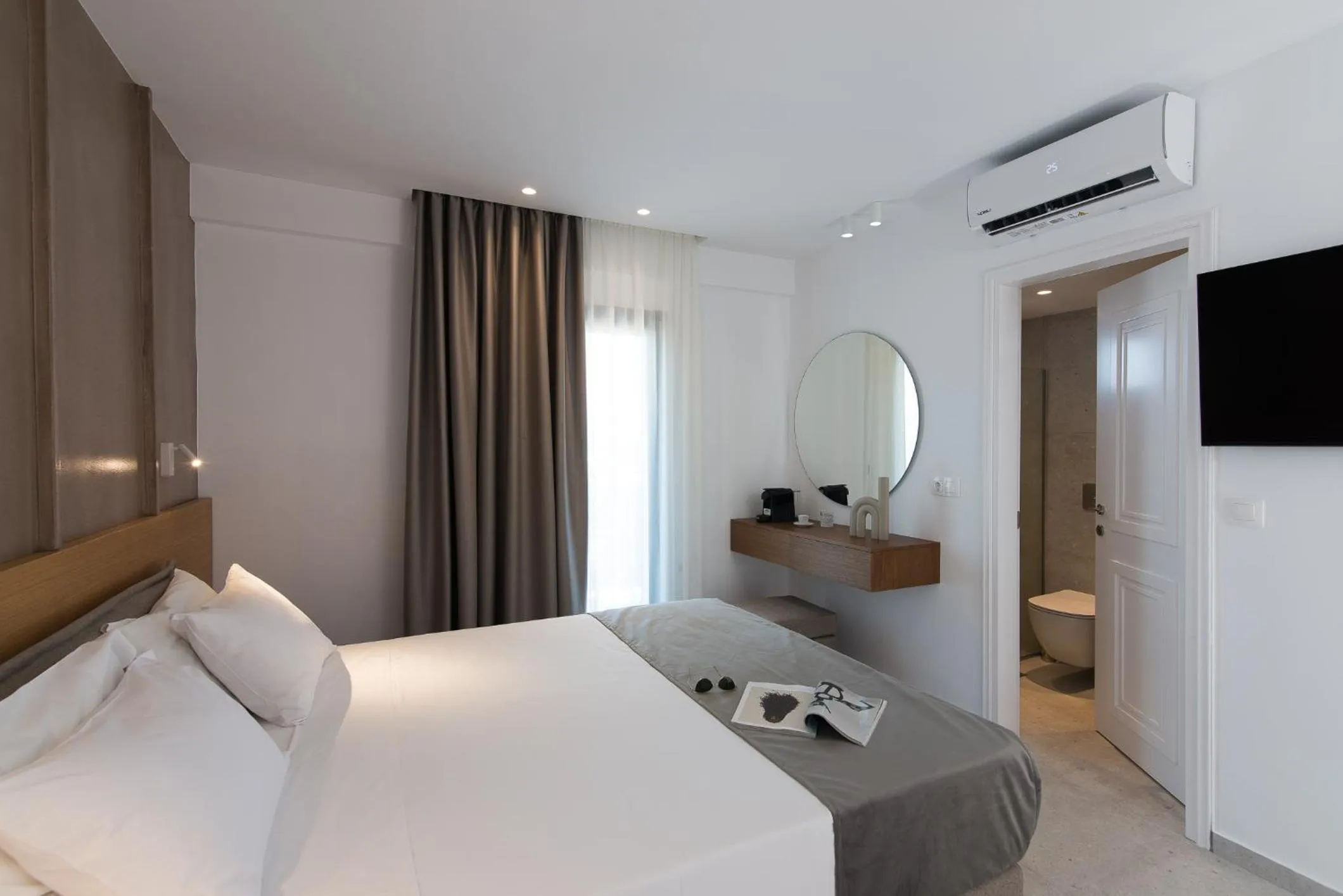 Bed in Nami Hotel & Suites