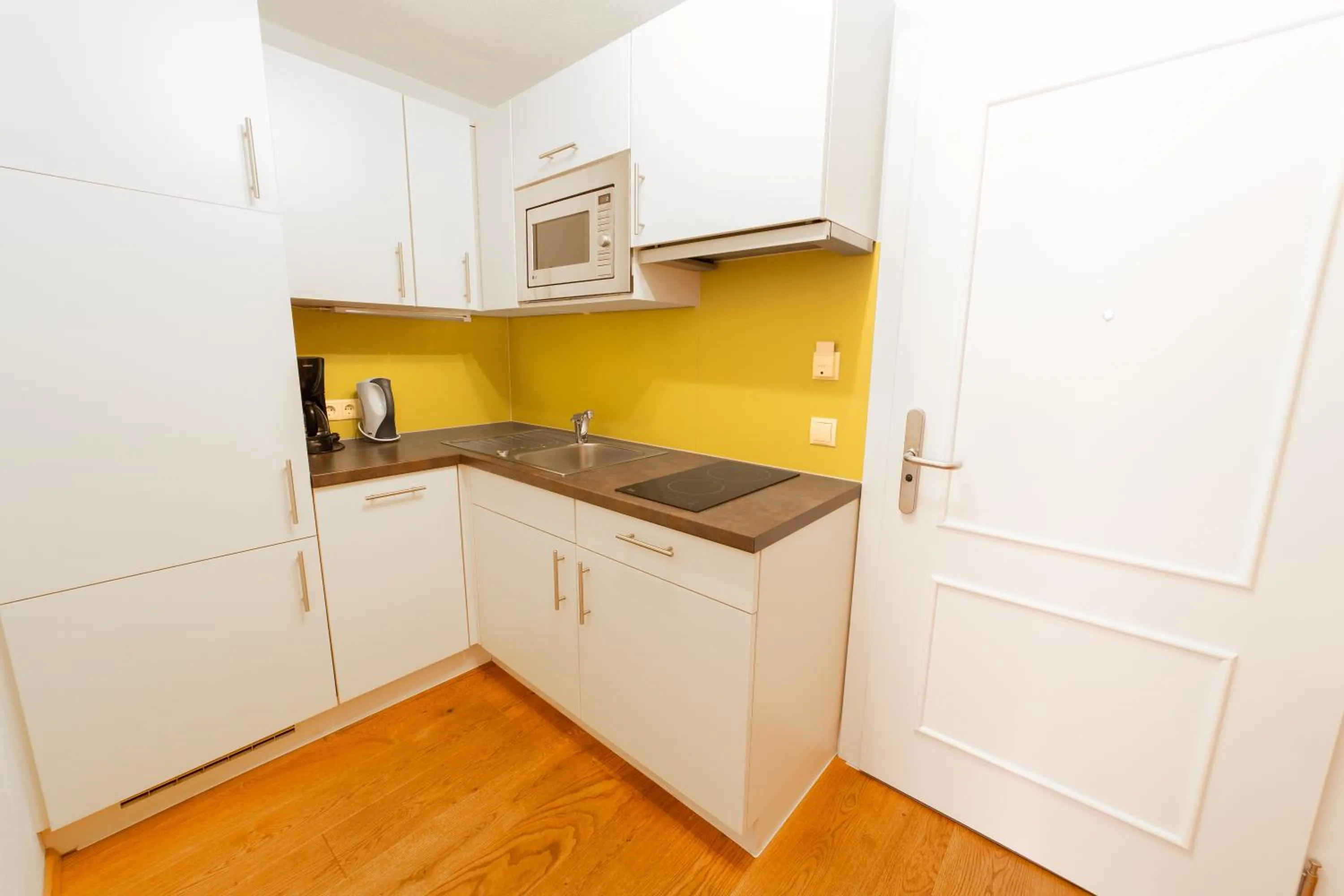 Kitchen or kitchenette in Aparthotel Hirschenau