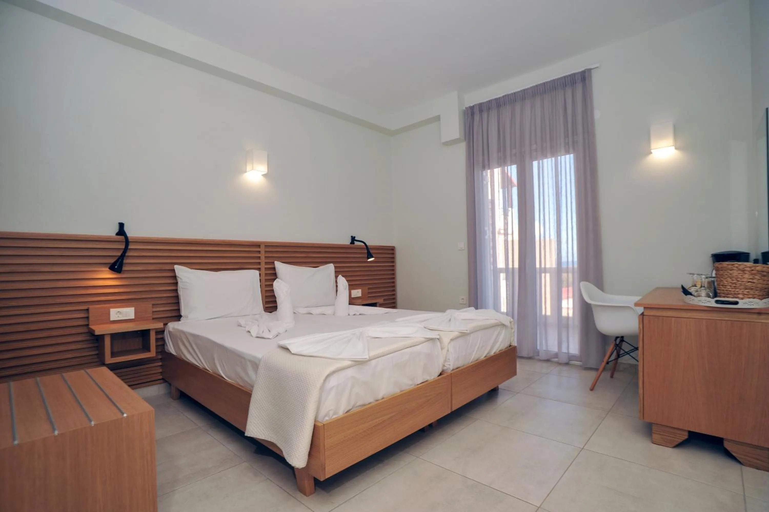 Bed in Mithos Premium Rooms
