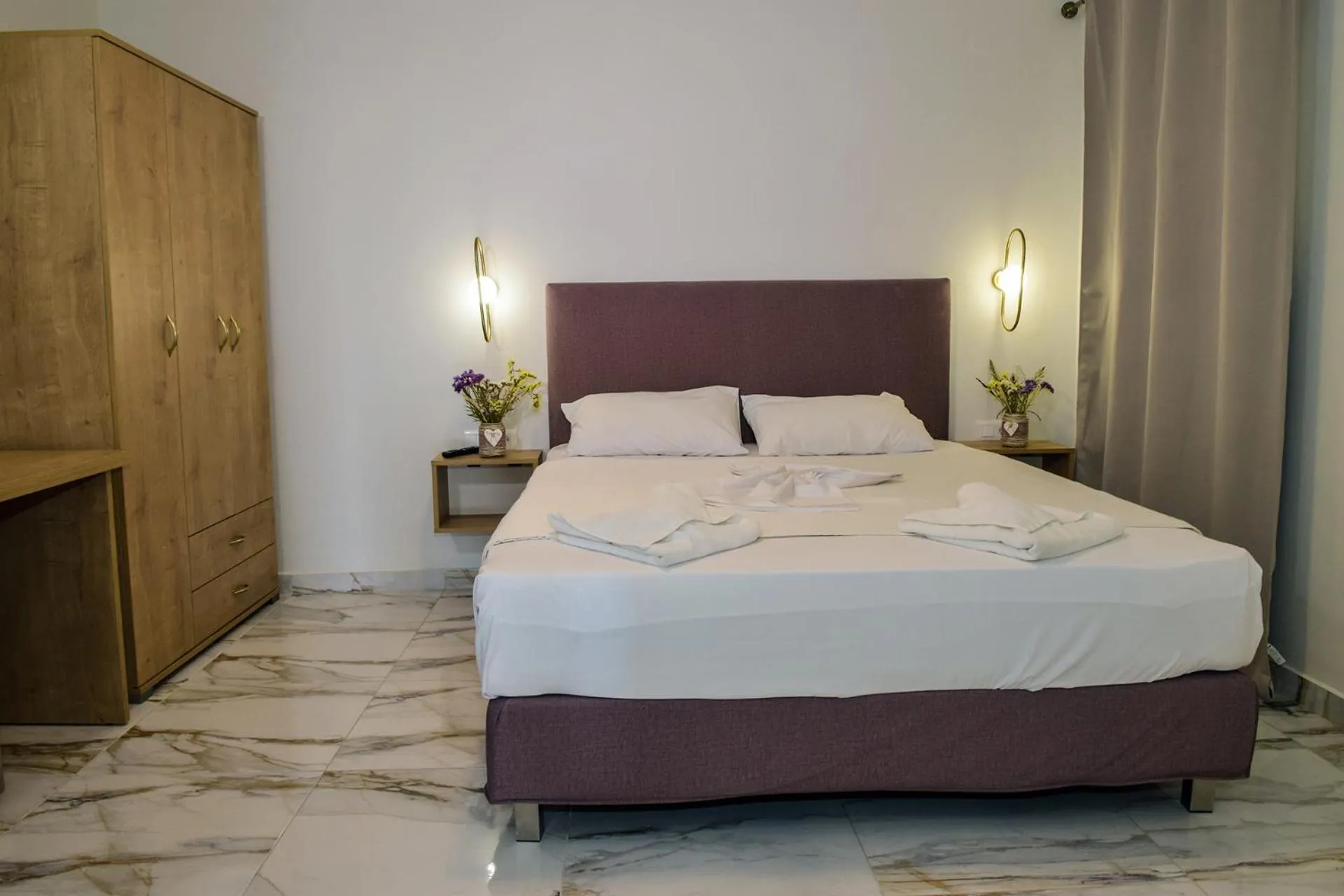 Bed in Mithos Premium Rooms