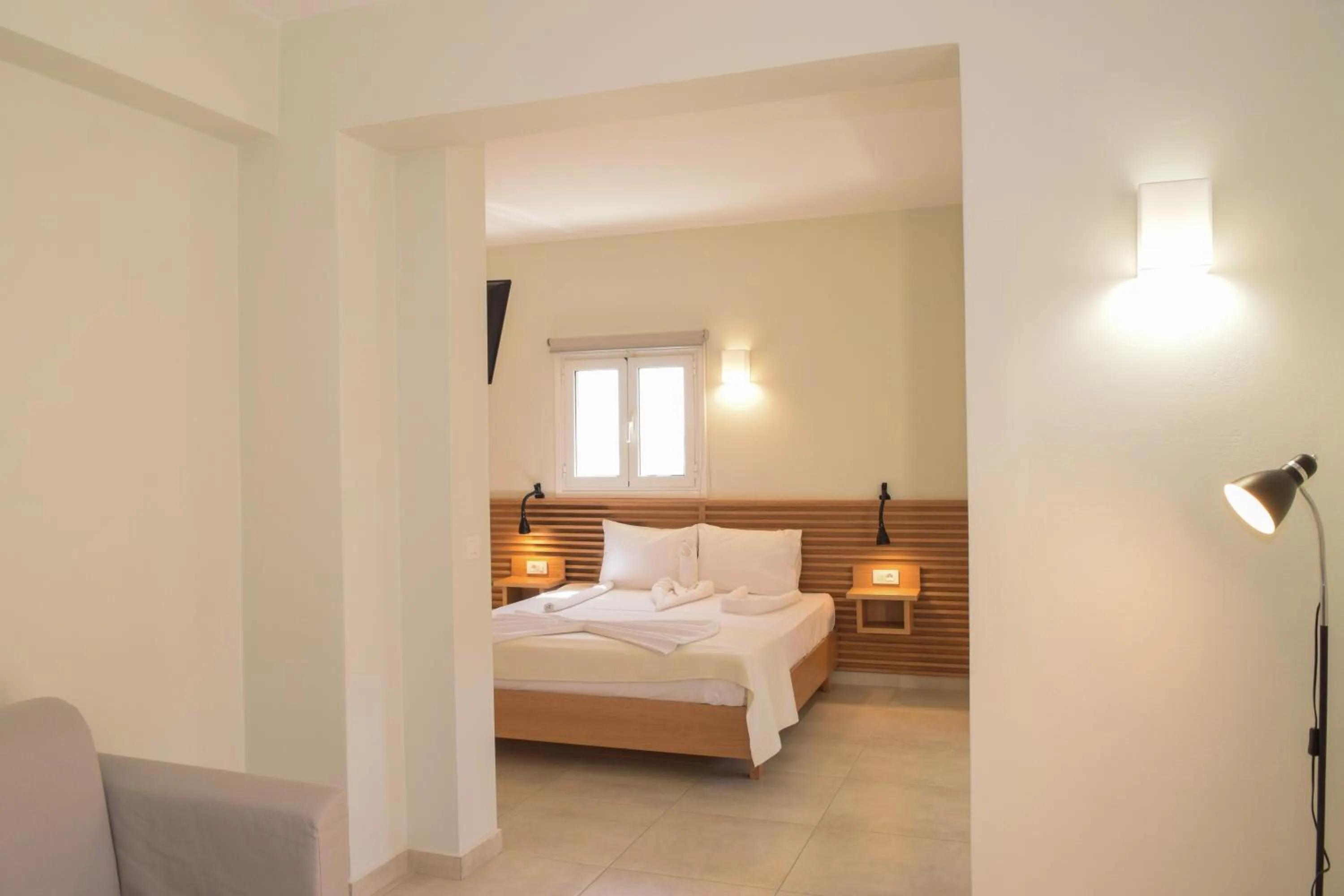 Bed in Mithos Premium Rooms