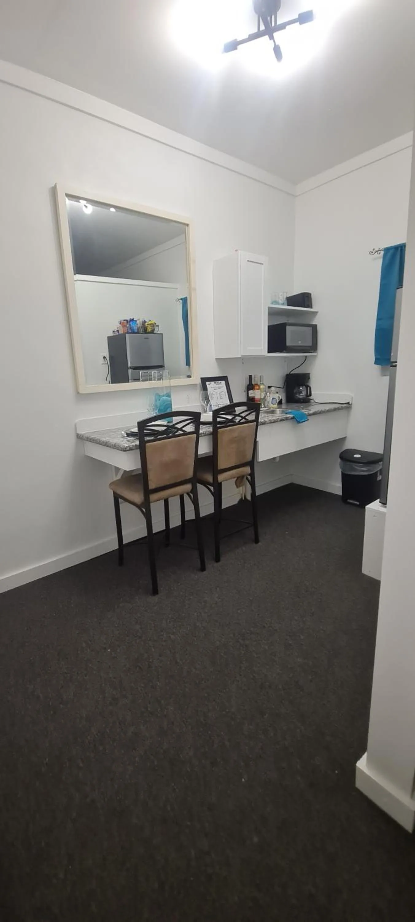 Kitchen or kitchenette in BELL At The Airport Suites Adults Only - Free Airport Transportation