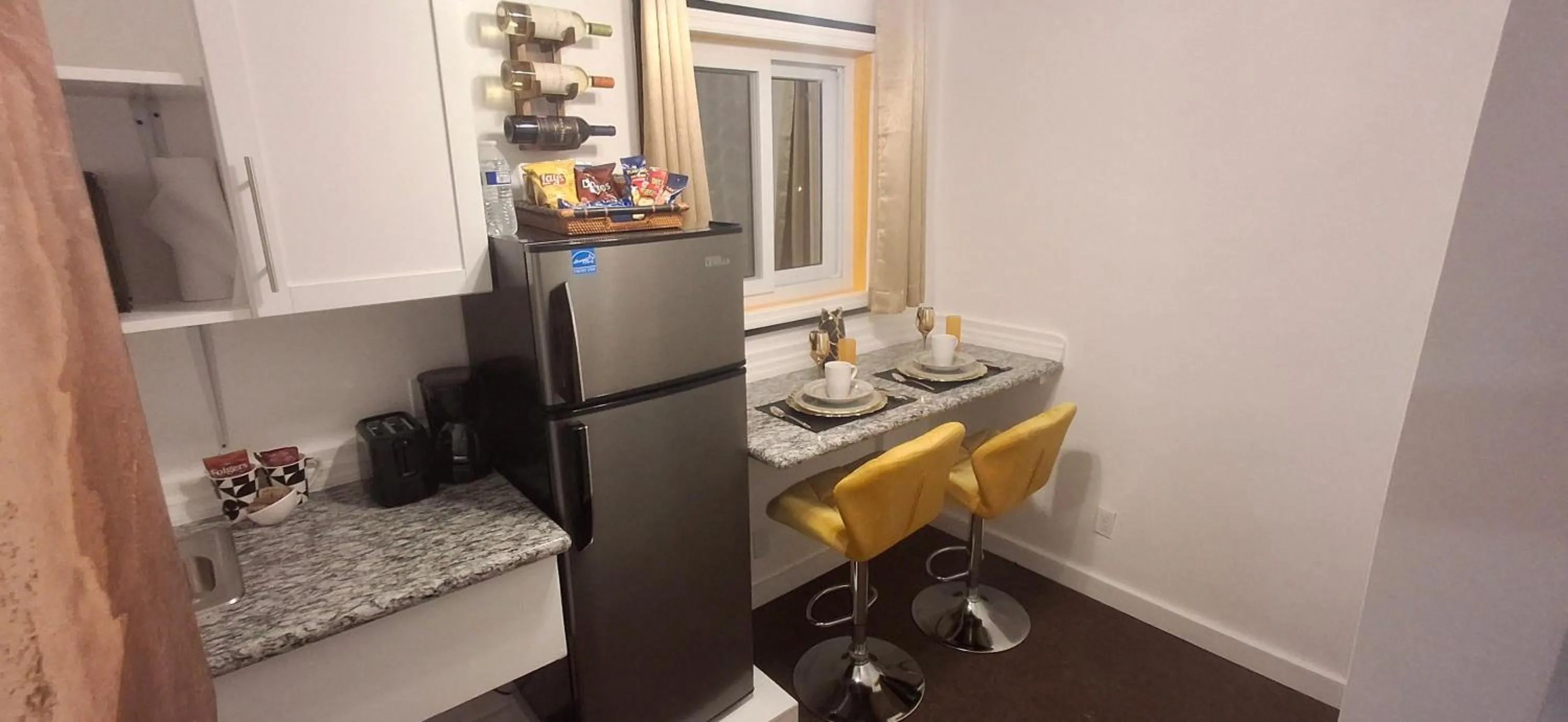 Kitchen or kitchenette in BELL At The Airport Suites Adults Only - Free Airport Transportation
