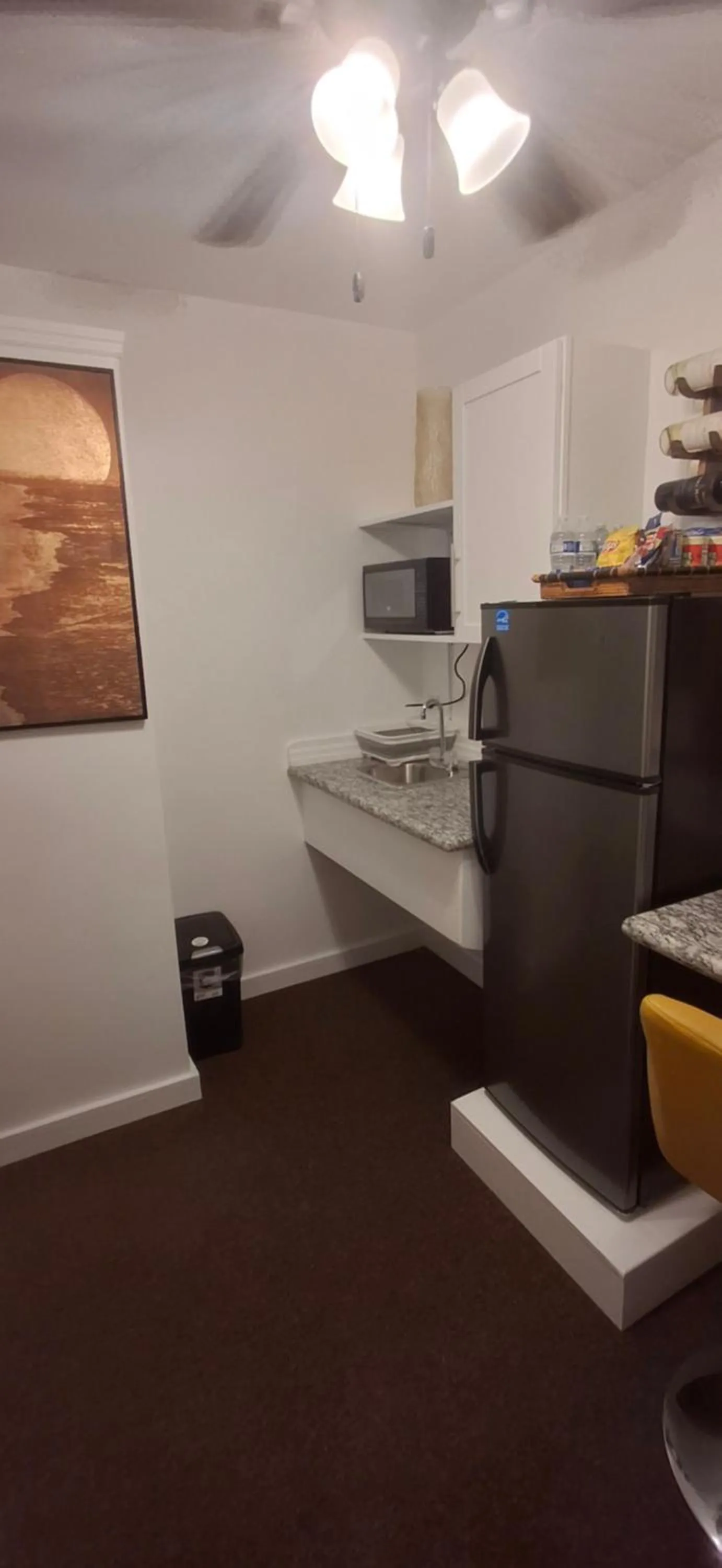 Kitchen or kitchenette in BELL At The Airport Suites Adults Only - Free Airport Transportation