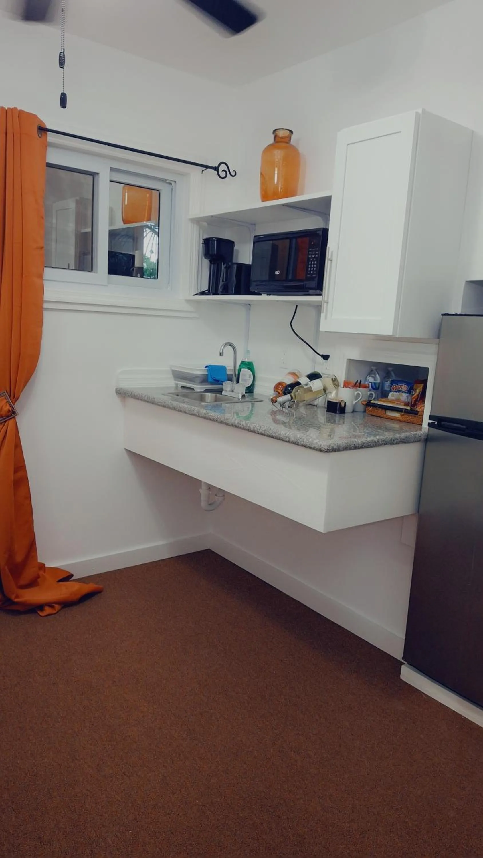 Kitchen or kitchenette in BELL At The Airport Suites Adults Only - Free Airport Transportation