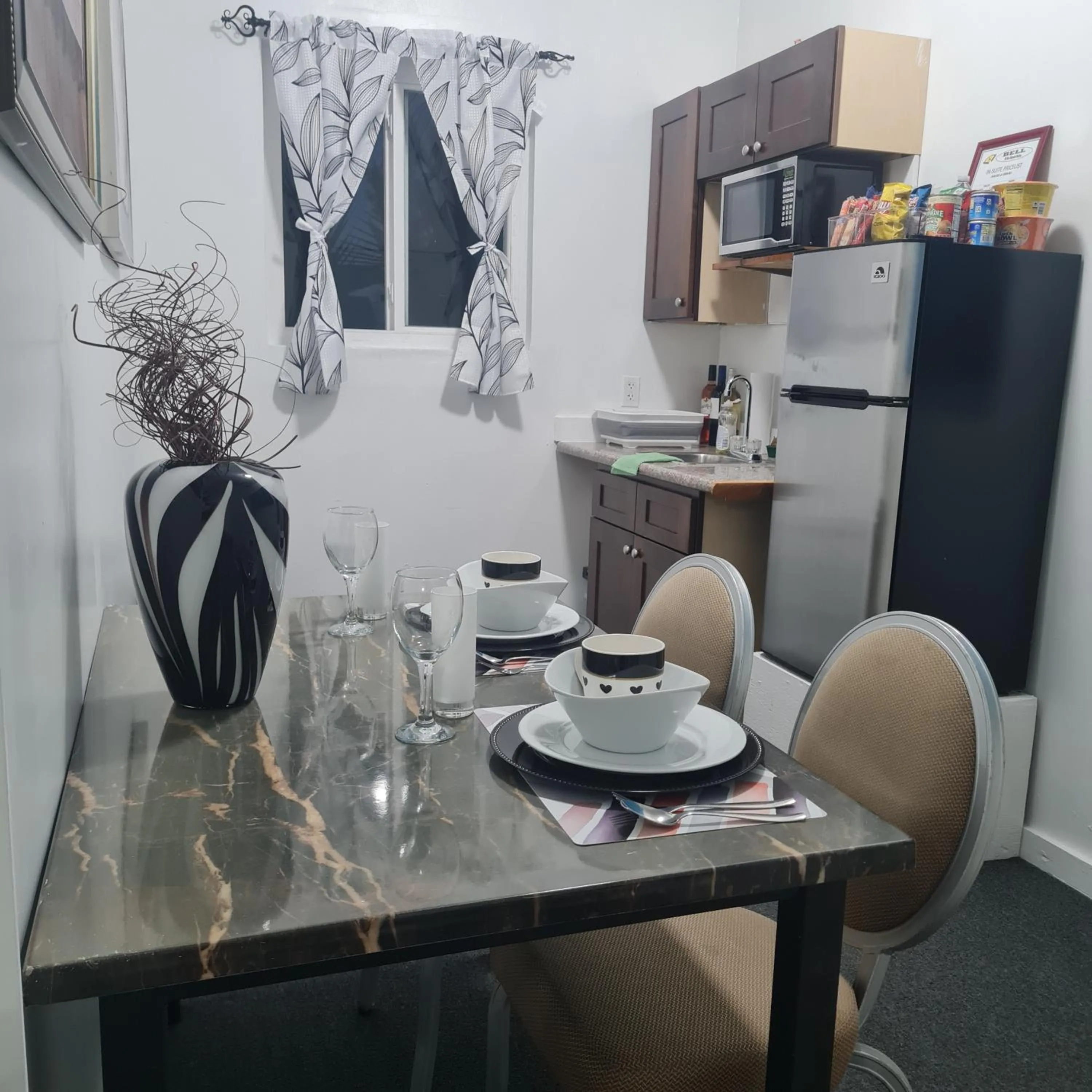 Kitchen or kitchenette in BELL At The Airport Suites Adults Only - Free Airport Transportation