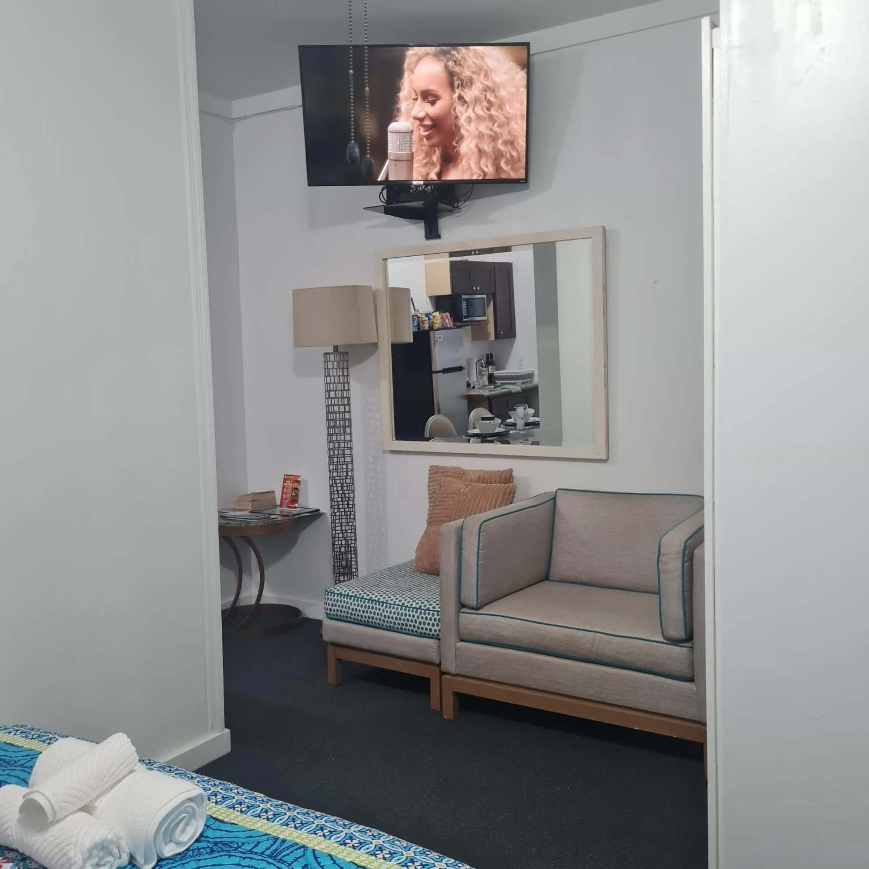 Seating area, Bed in BELL At The Airport Suites Adults Only - Free Airport Transportation