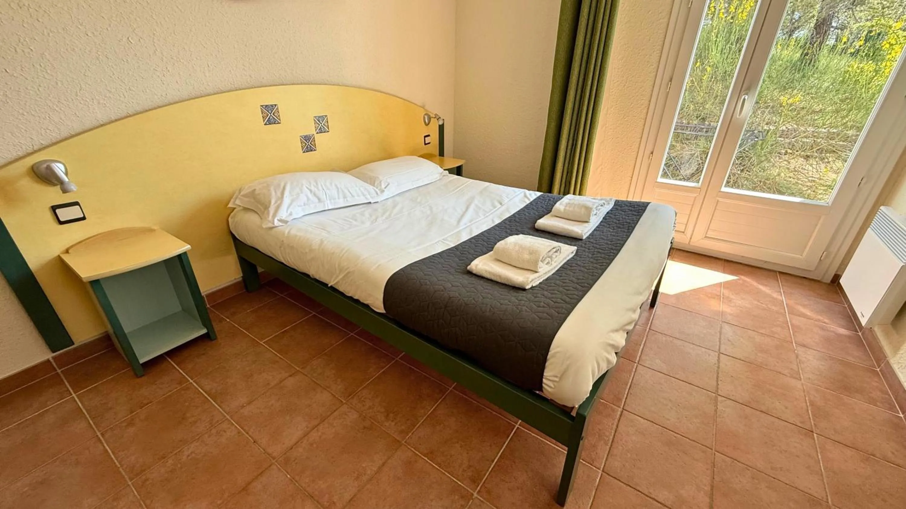 Bed in Village vacances Le Hameau des Oliviers