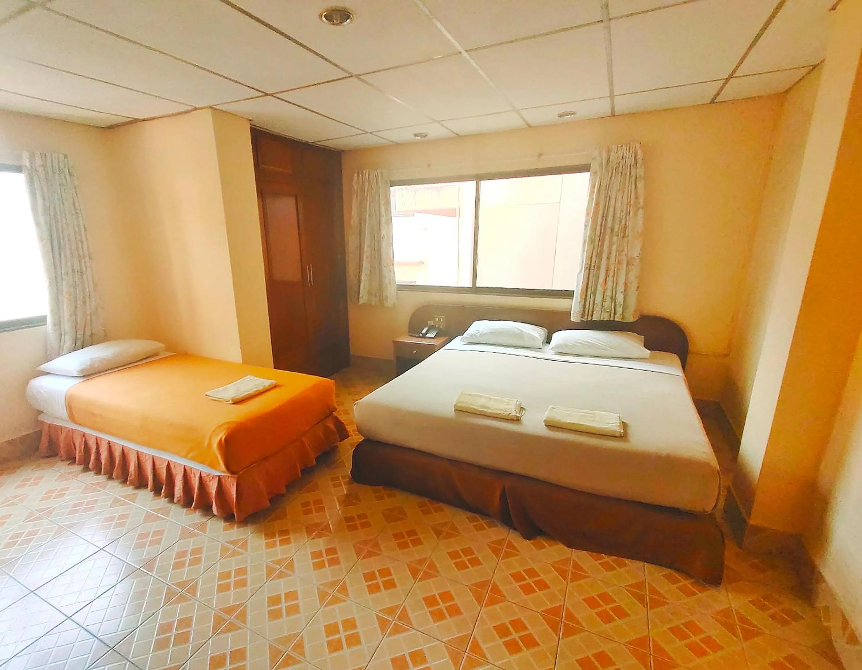 Bed in Top Thai Hotel