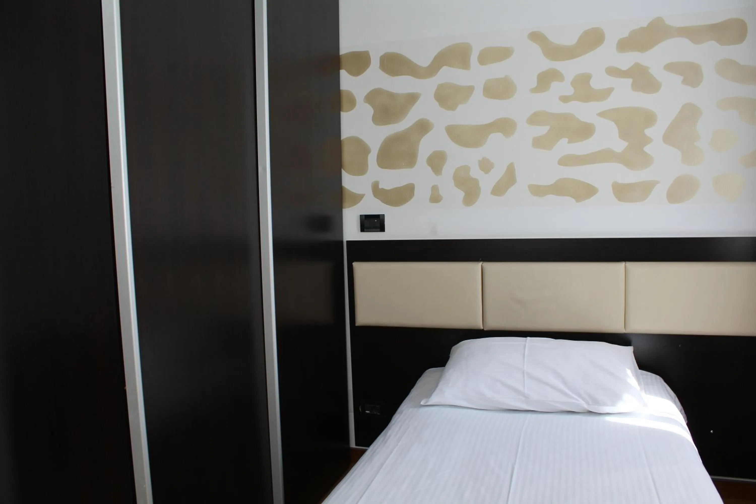 Bed in Hotel Diplomat