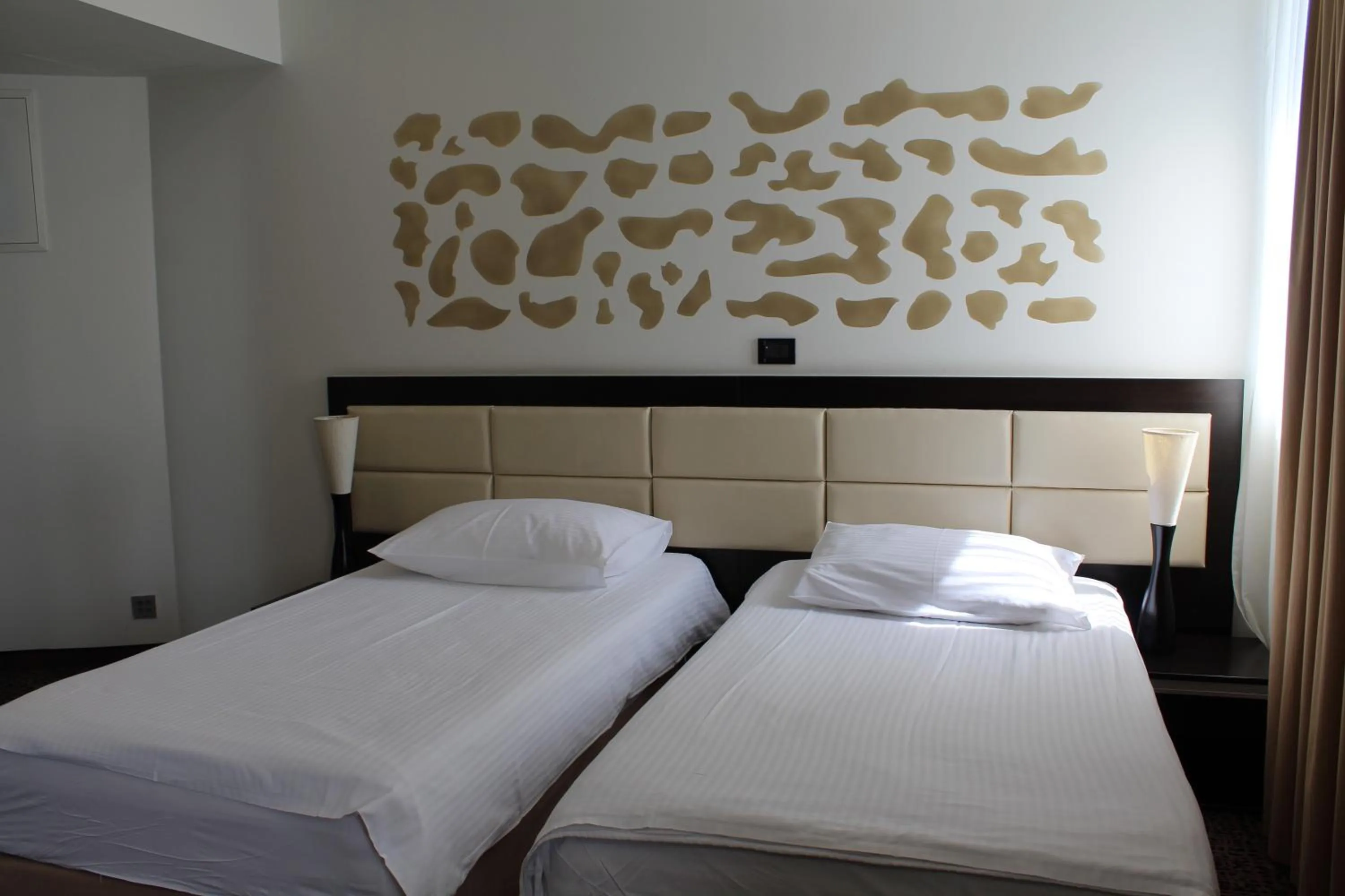 Bed in Hotel Diplomat