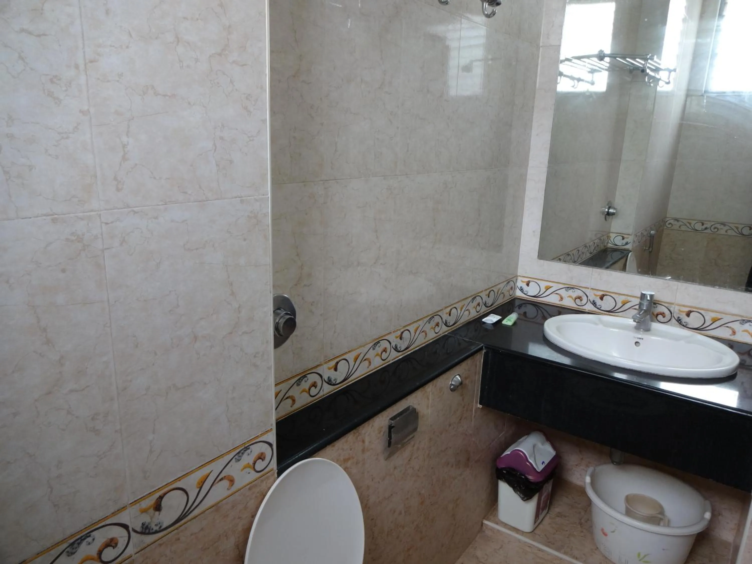 Bathroom in Lotus Comfort - A Pondy Hotel