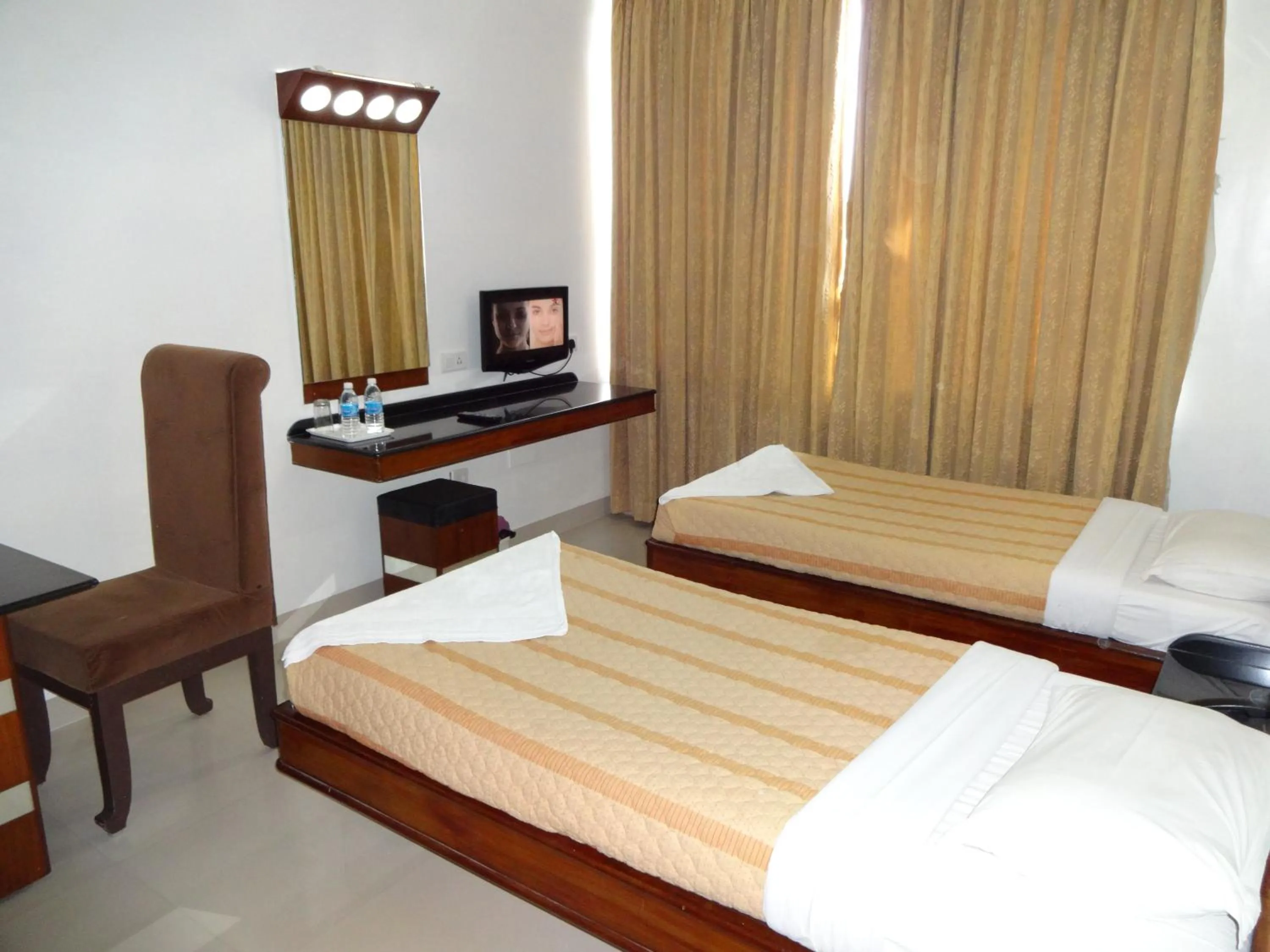 Photo of the whole room, Bed in Lotus Comfort - A Pondy Hotel