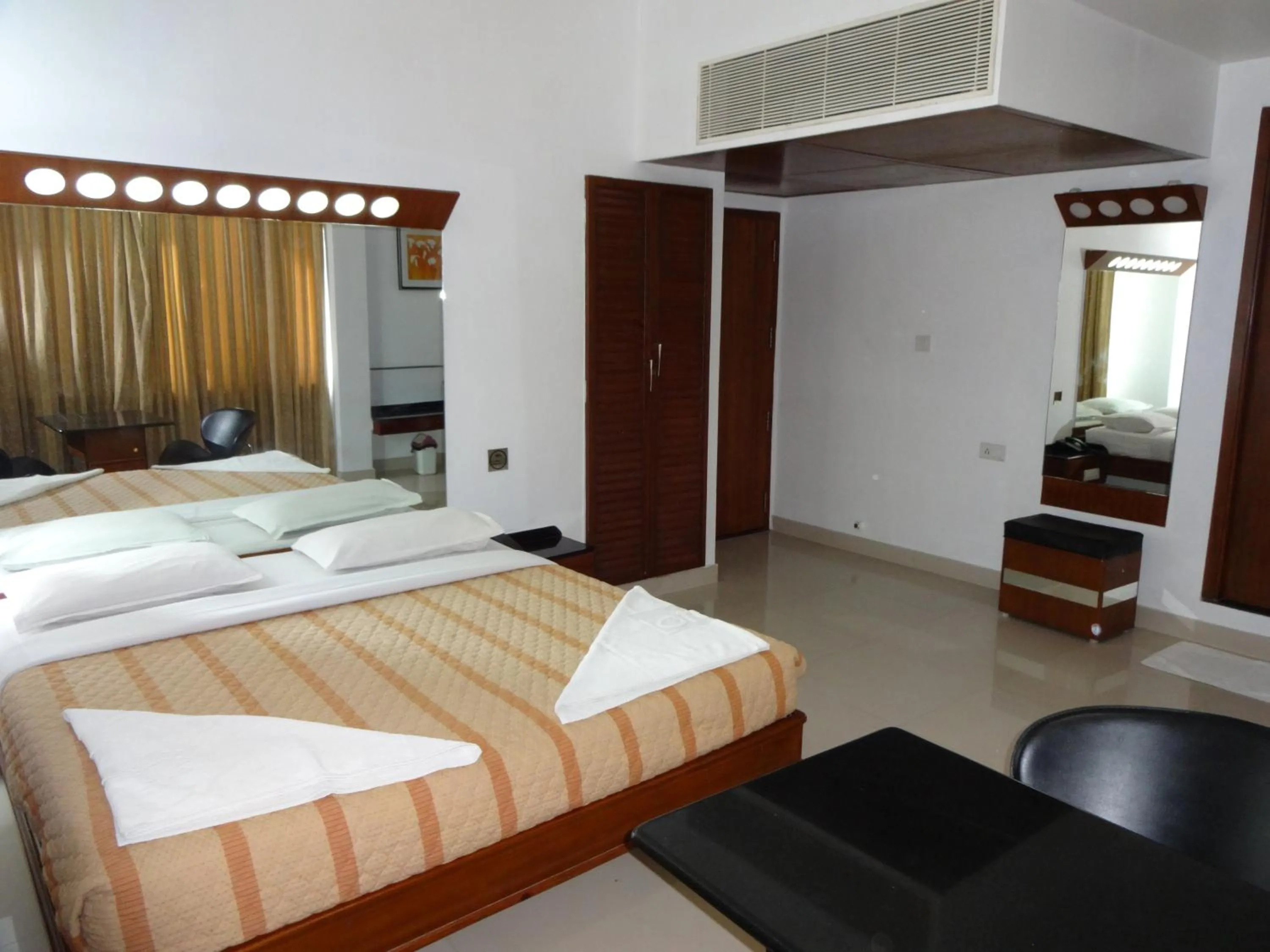 Photo of the whole room, Bed in Lotus Comfort - A Pondy Hotel
