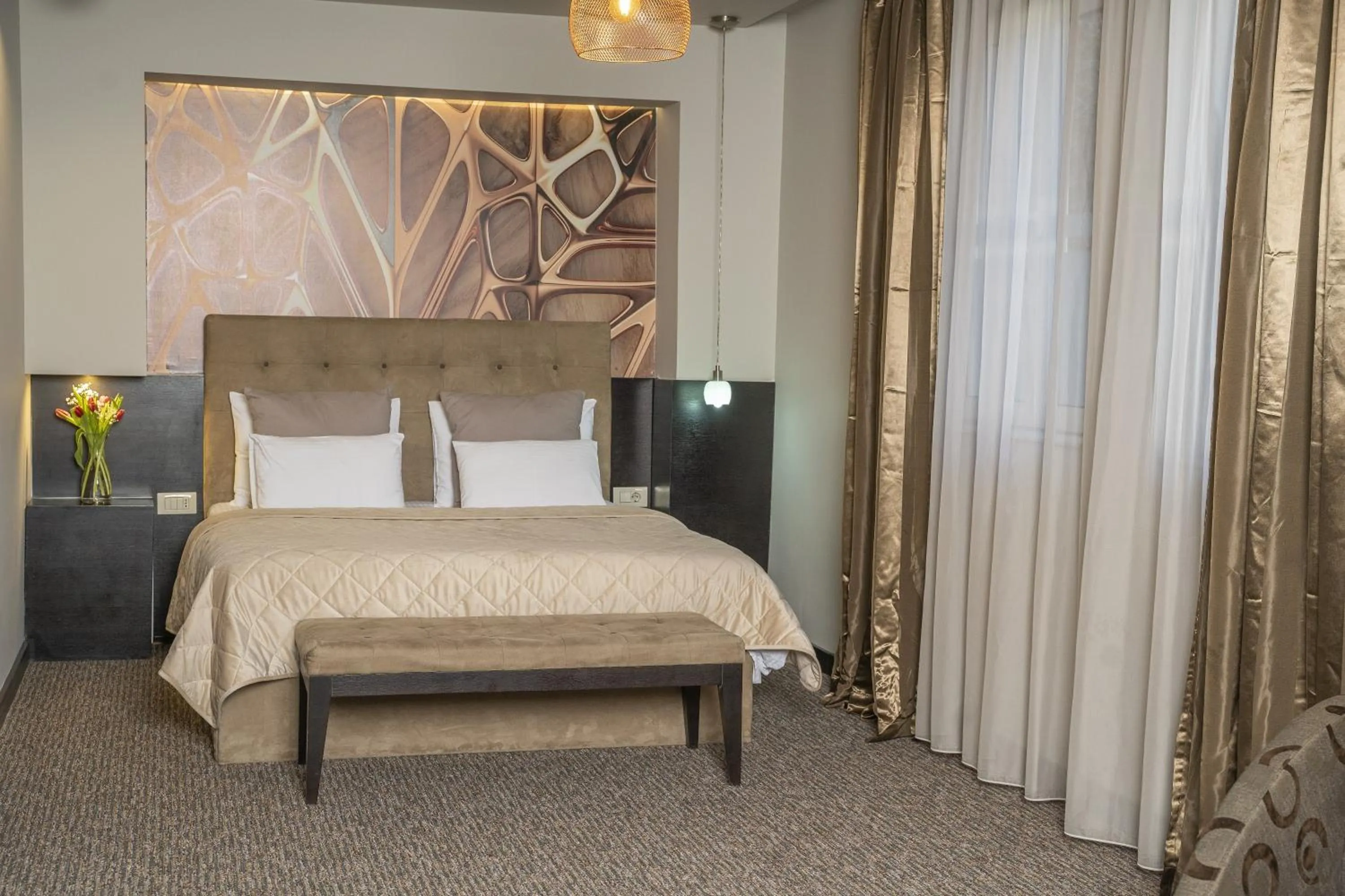 Bed in Akacija Luxury Suites