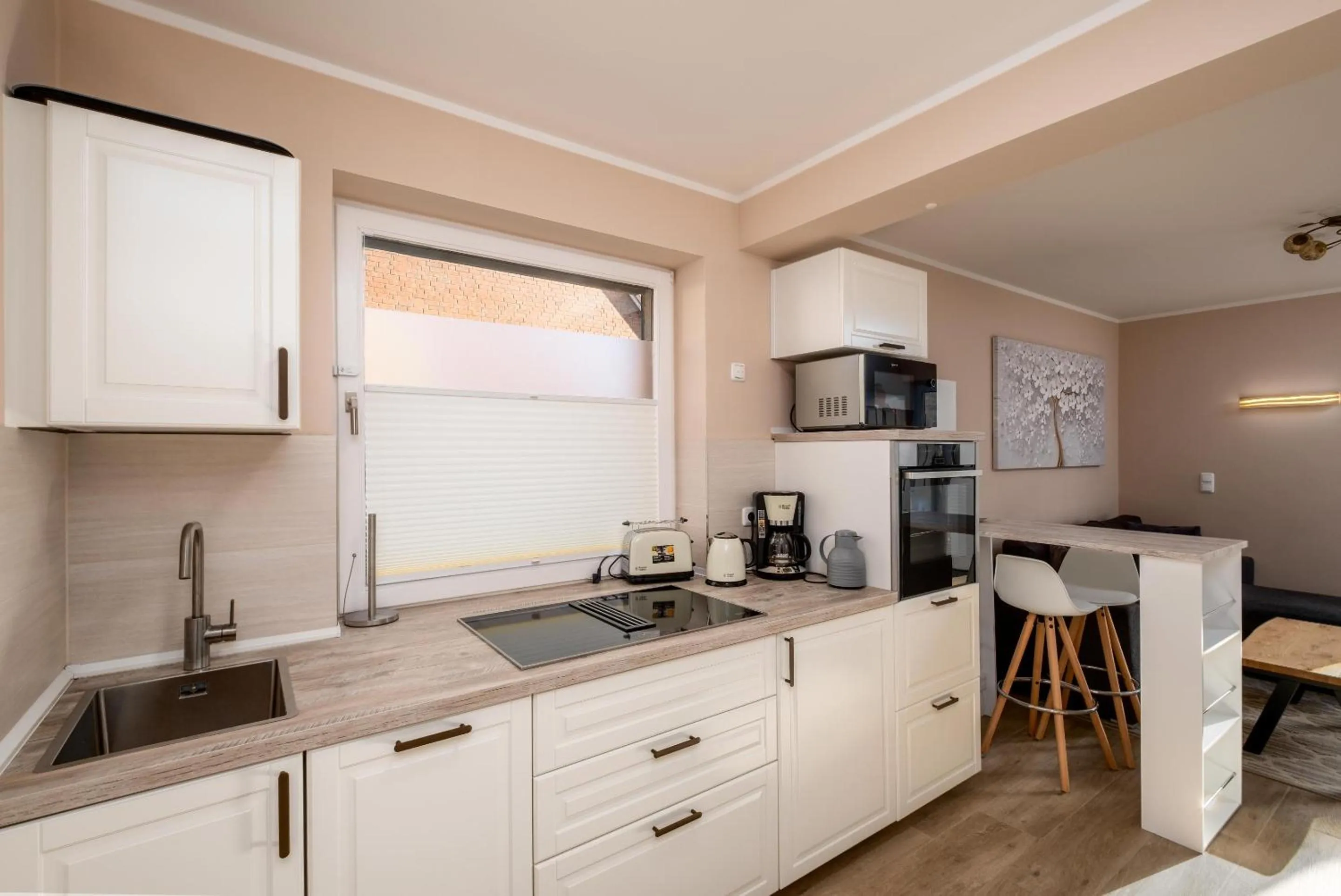 Kitchen or kitchenette in Gästehaus "Kleines Stadtidyll" -Zimmer und Apartments