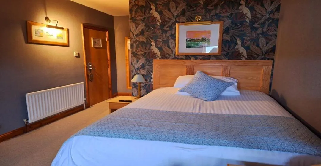 Bed in Washington Central Hotel and Sleepwell Inn