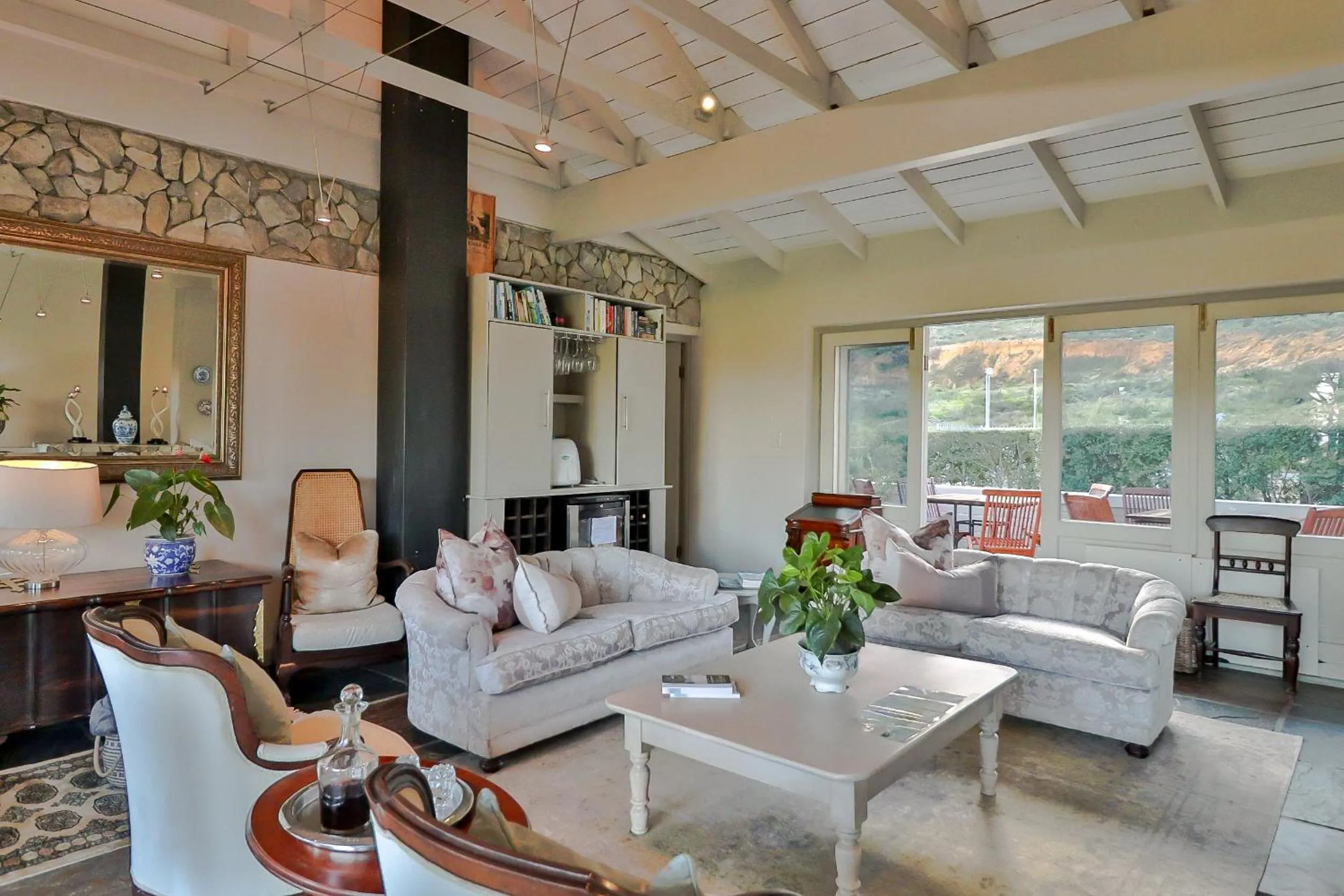 Communal lounge/ TV room in Hermanus Lodge on the Green - Solar Power