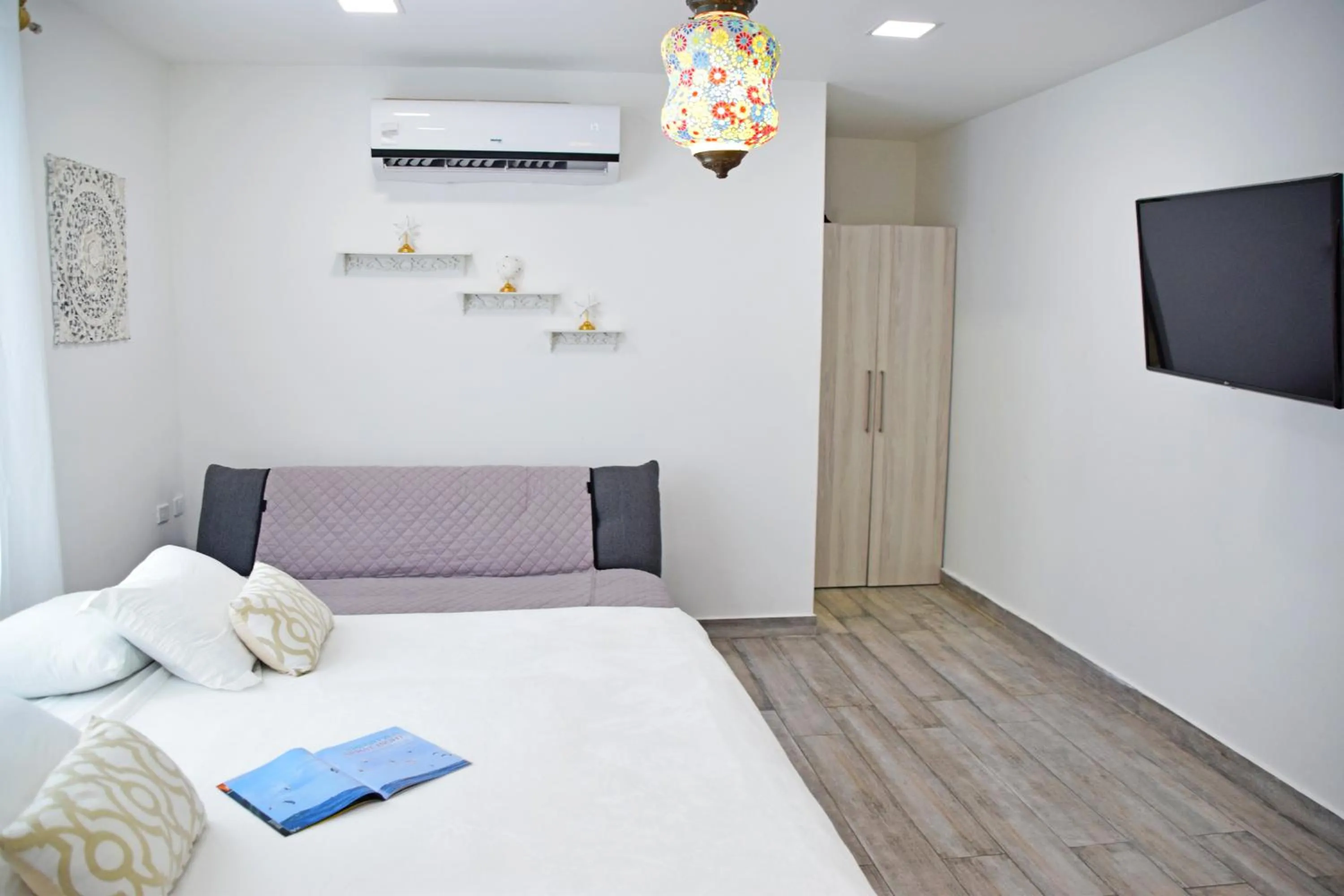 Bed in Le Castel Blanc Hotel Boutique