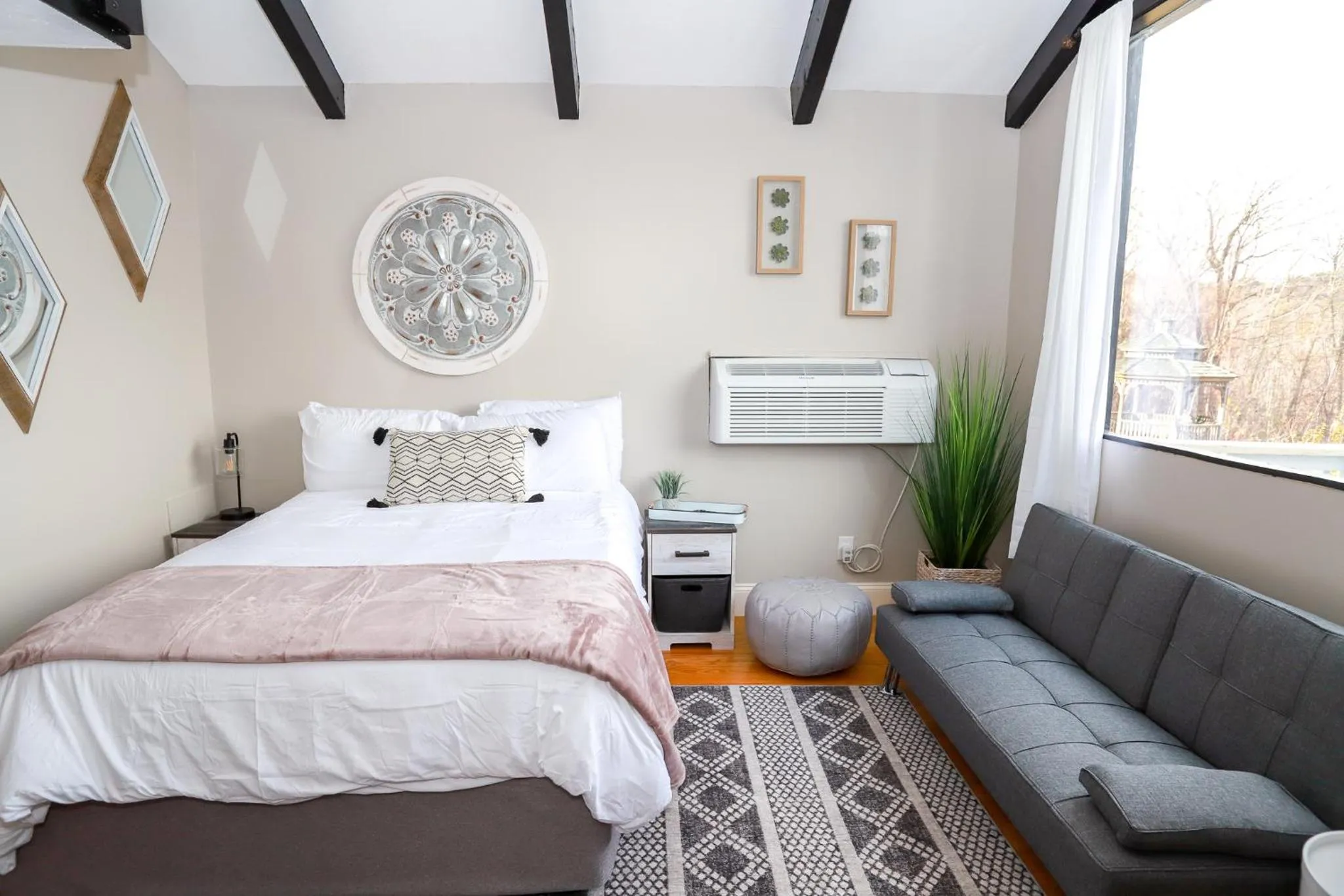 Bed in Gunstock Inn & Suites