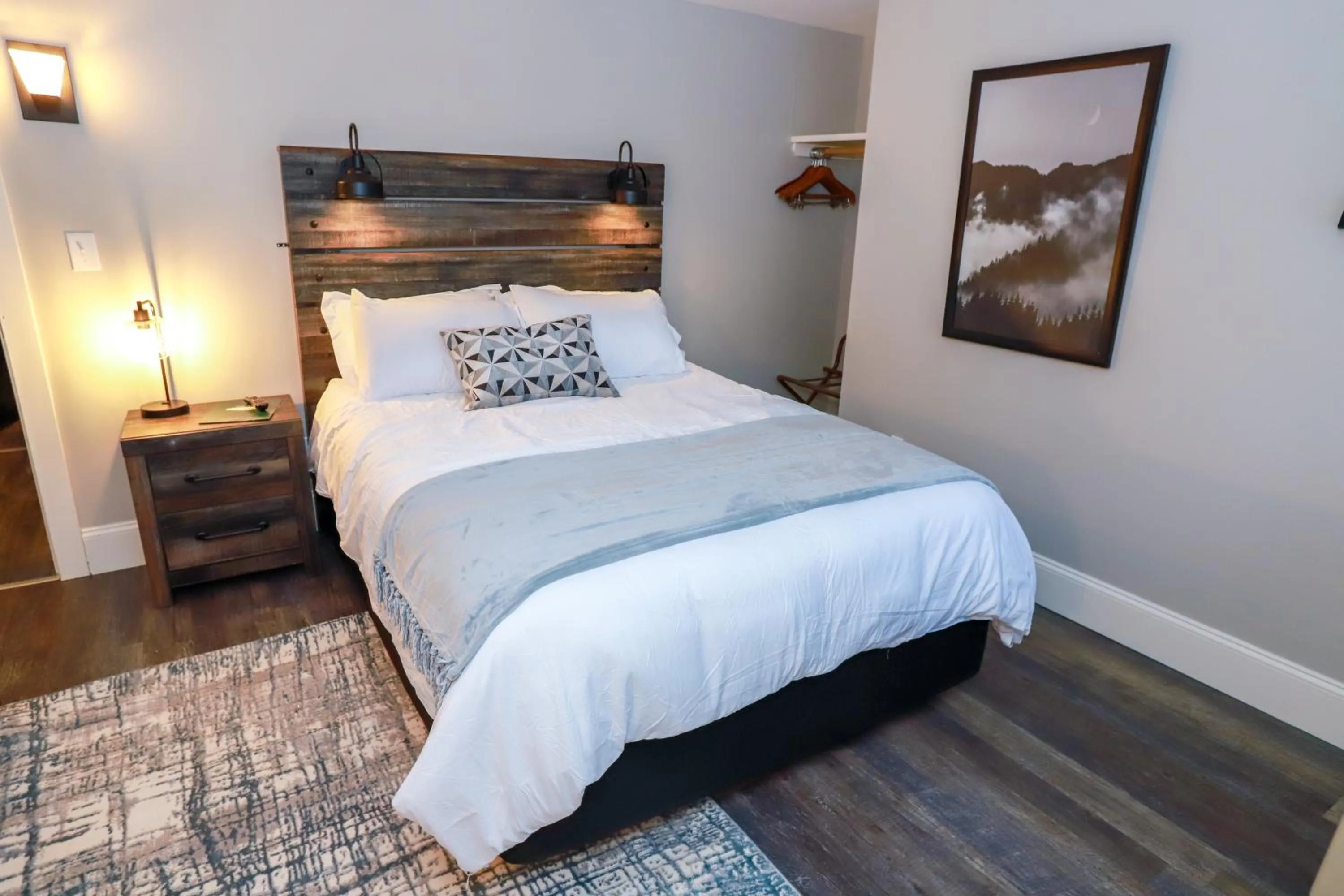 Bed in Gunstock Inn & Suites