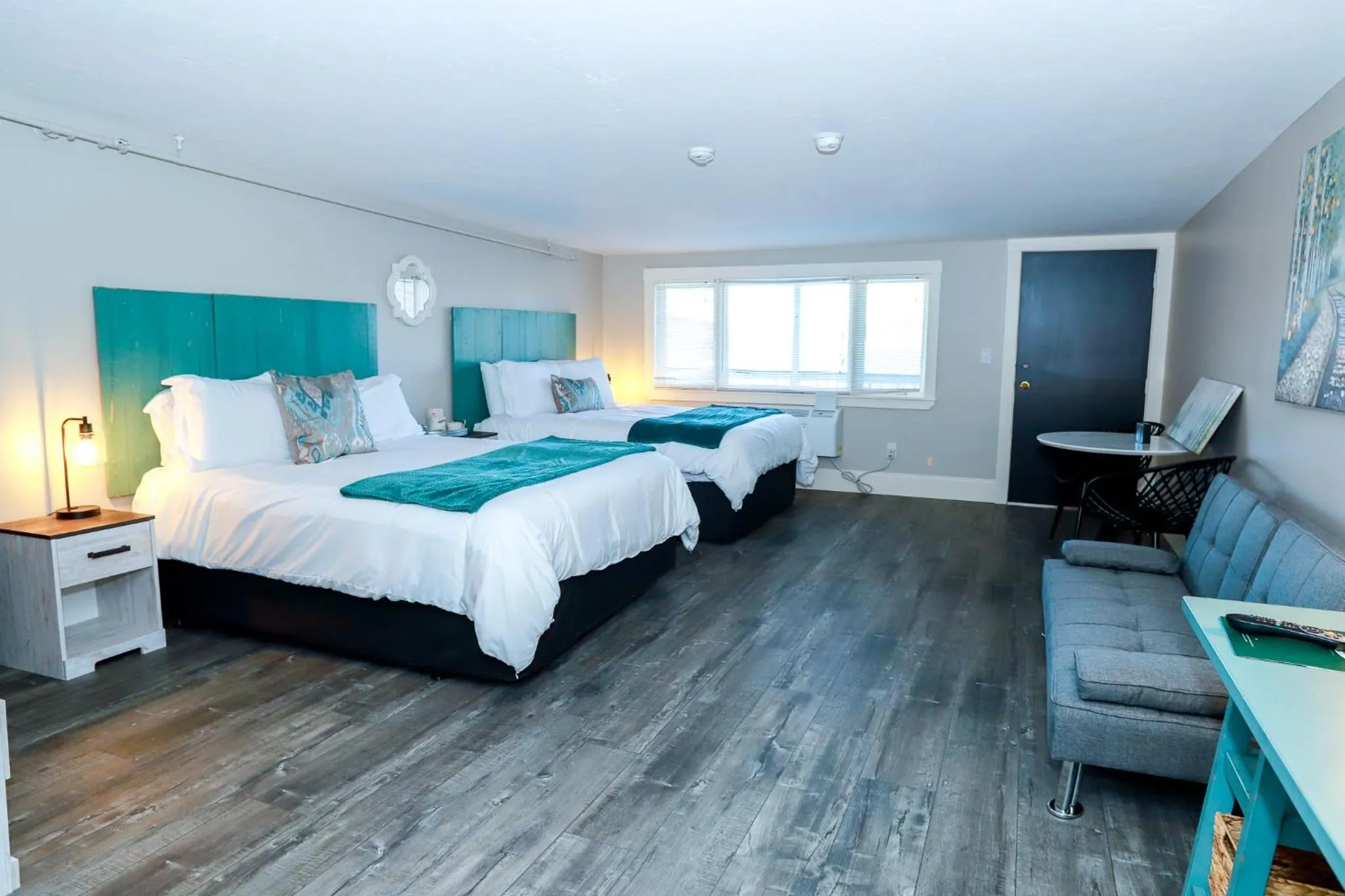 Bed in Gunstock Inn & Suites