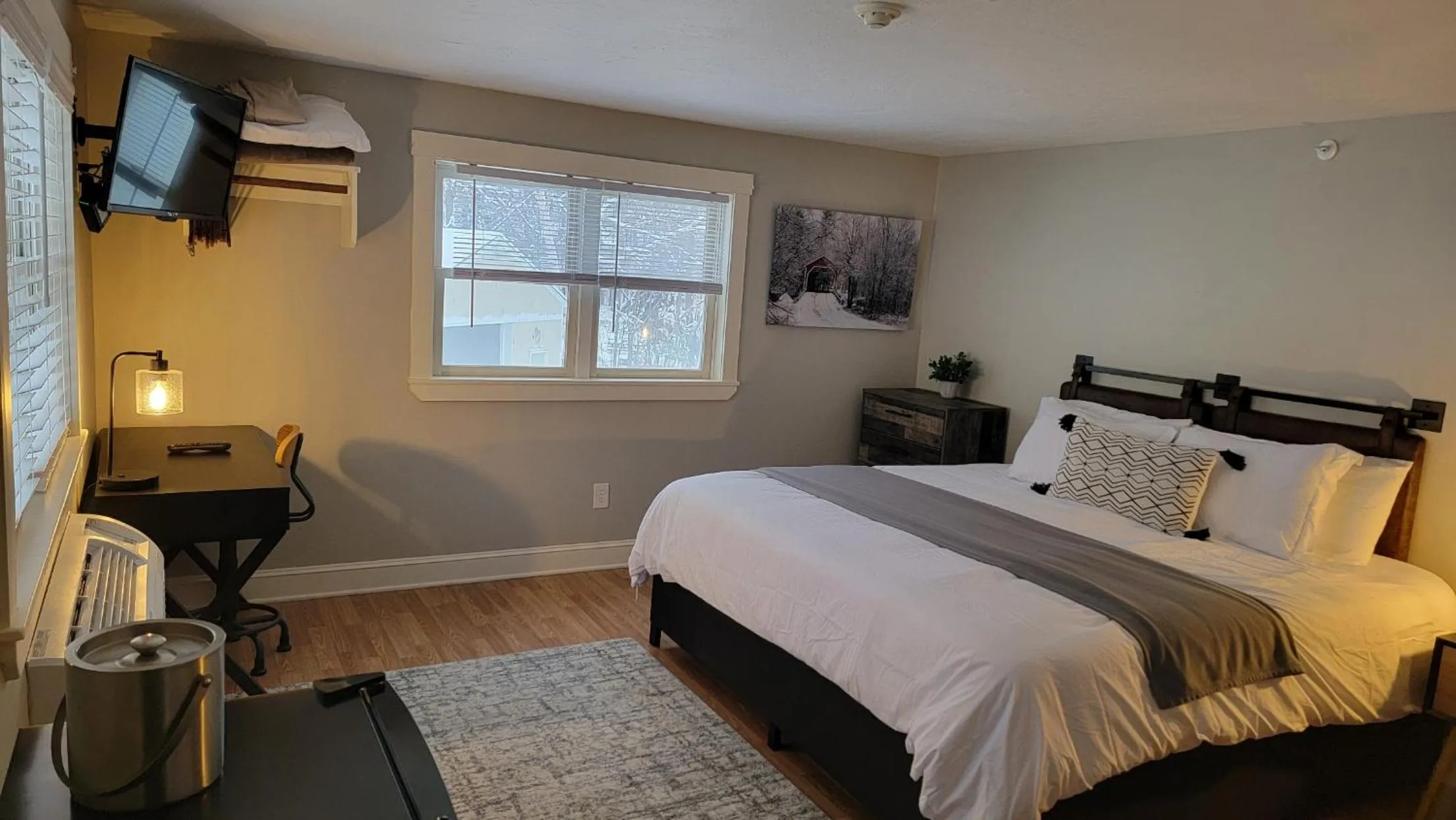 Bed in Gunstock Inn & Suites