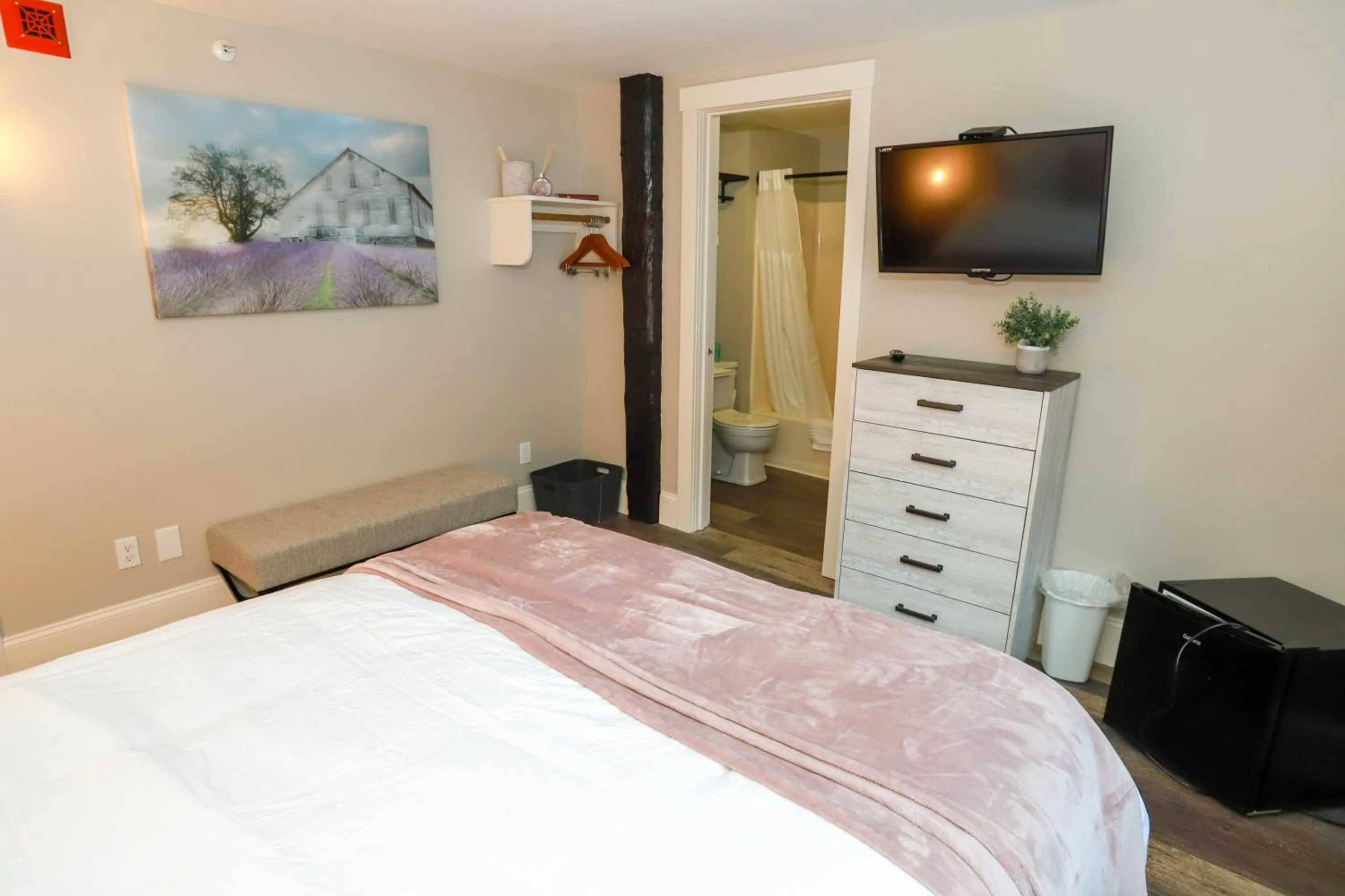 Bed in Gunstock Inn & Suites