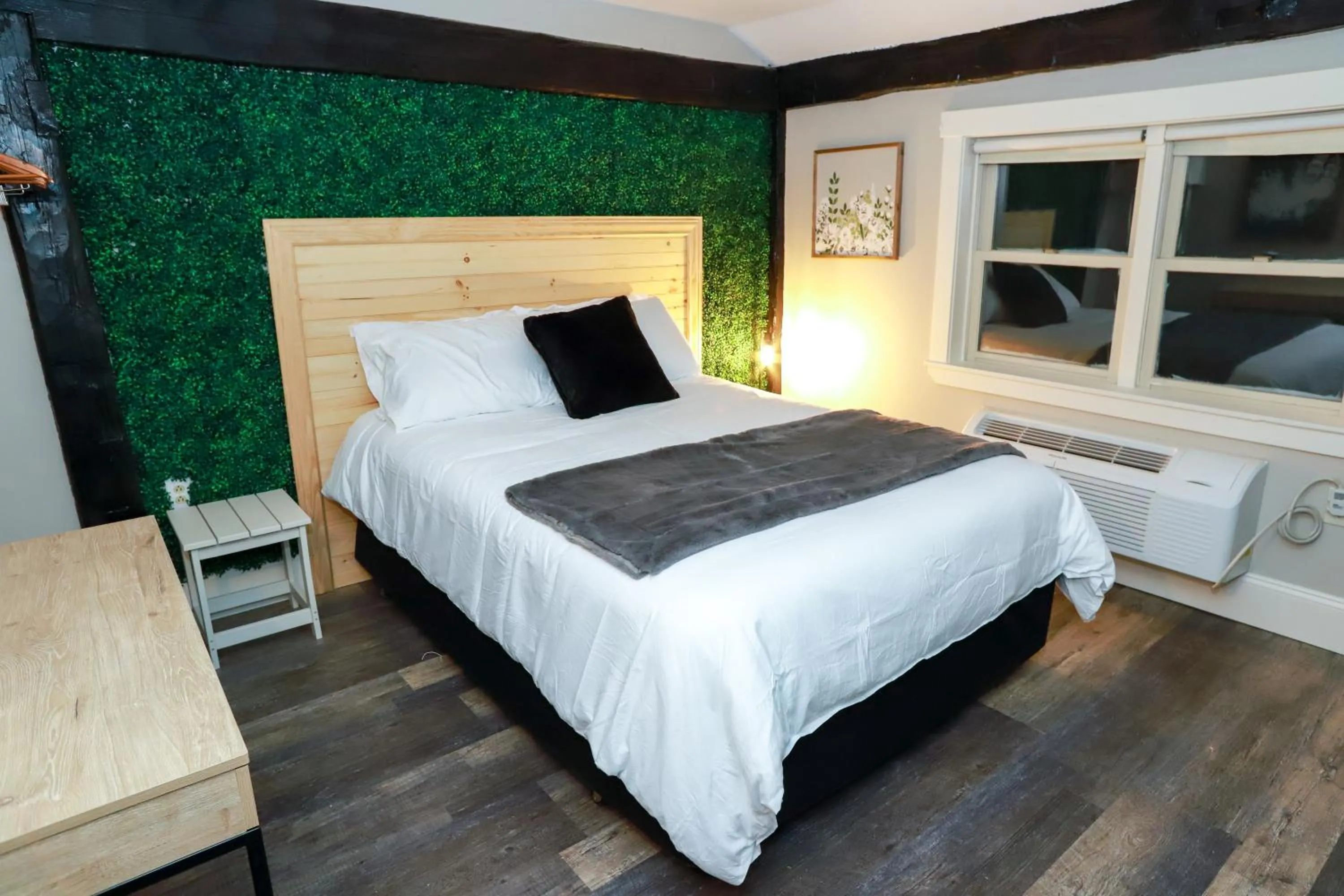 Bed in Gunstock Inn & Suites