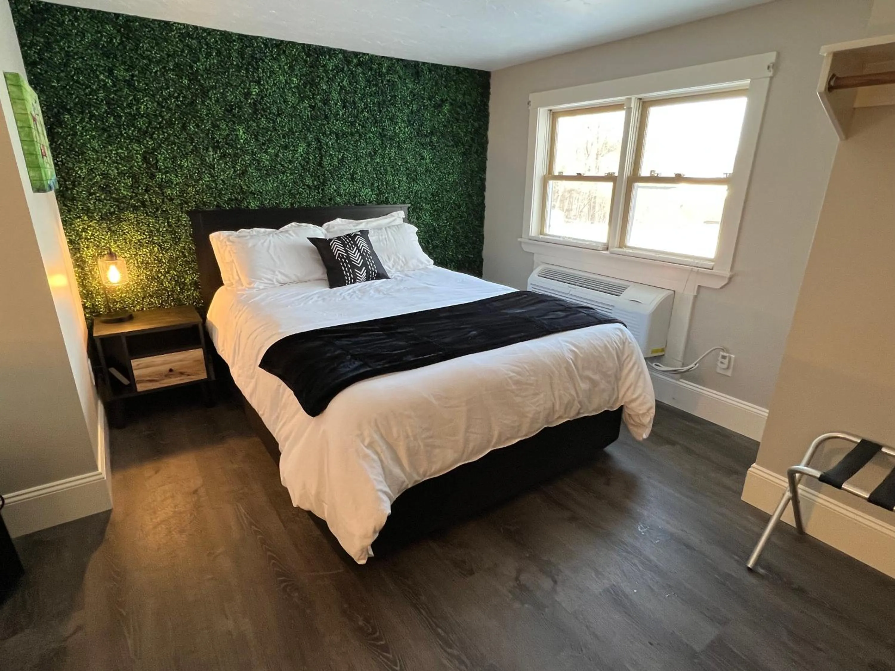 Bed in Gunstock Inn & Suites