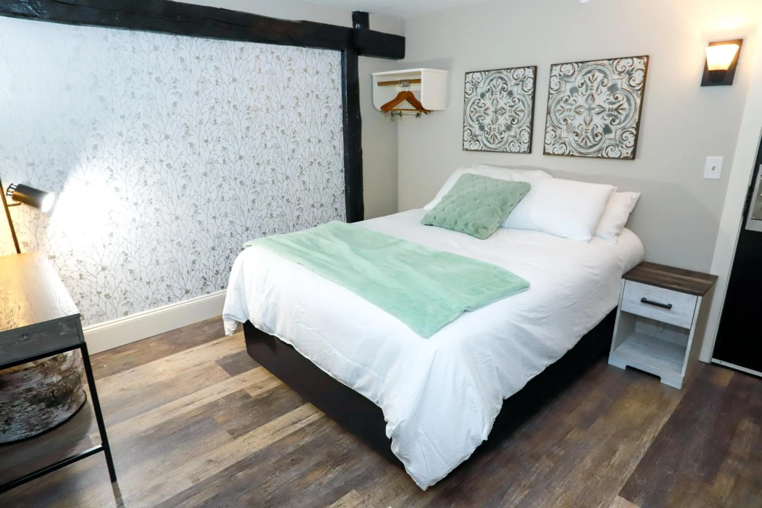 Bed in Gunstock Inn & Suites