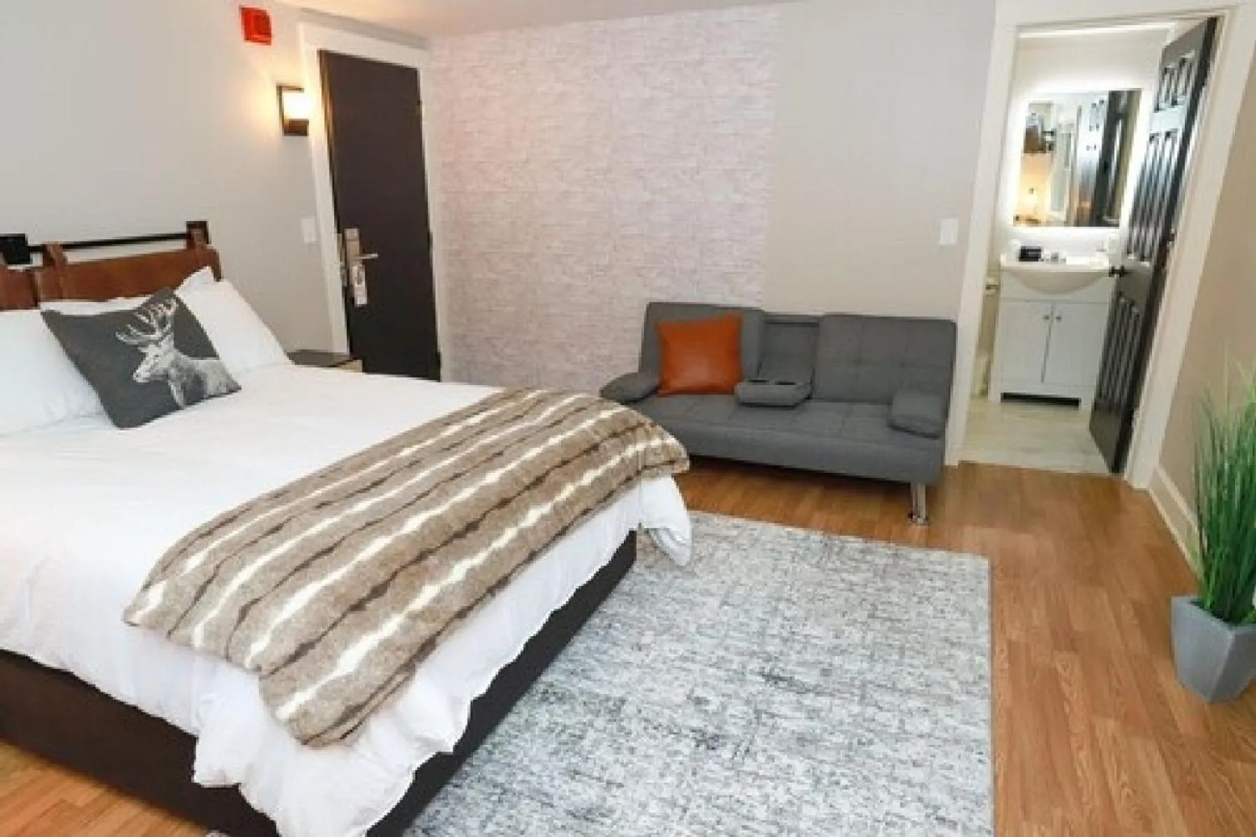 Bed in Gunstock Inn & Suites