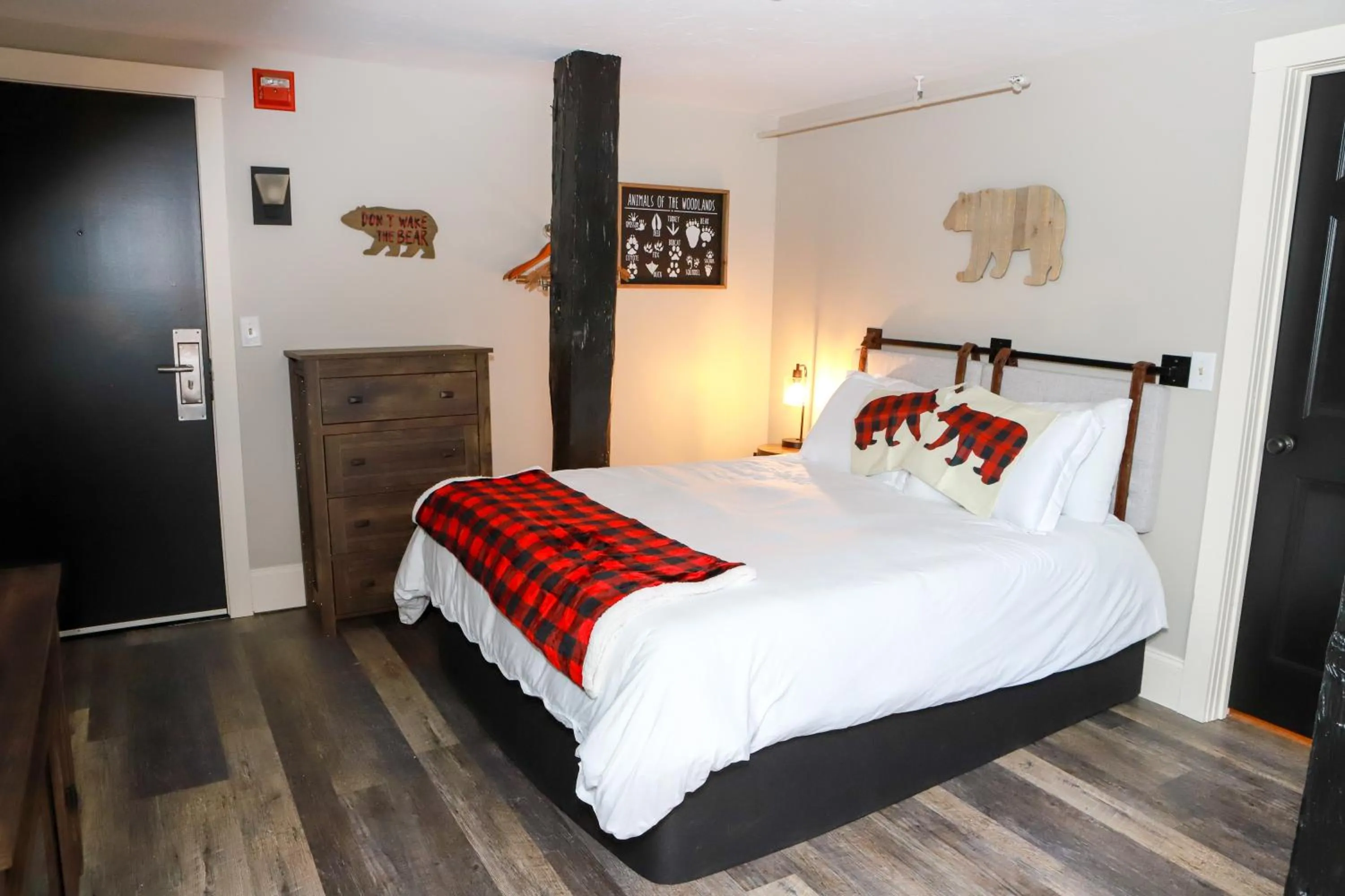 Bed in Gunstock Inn & Suites