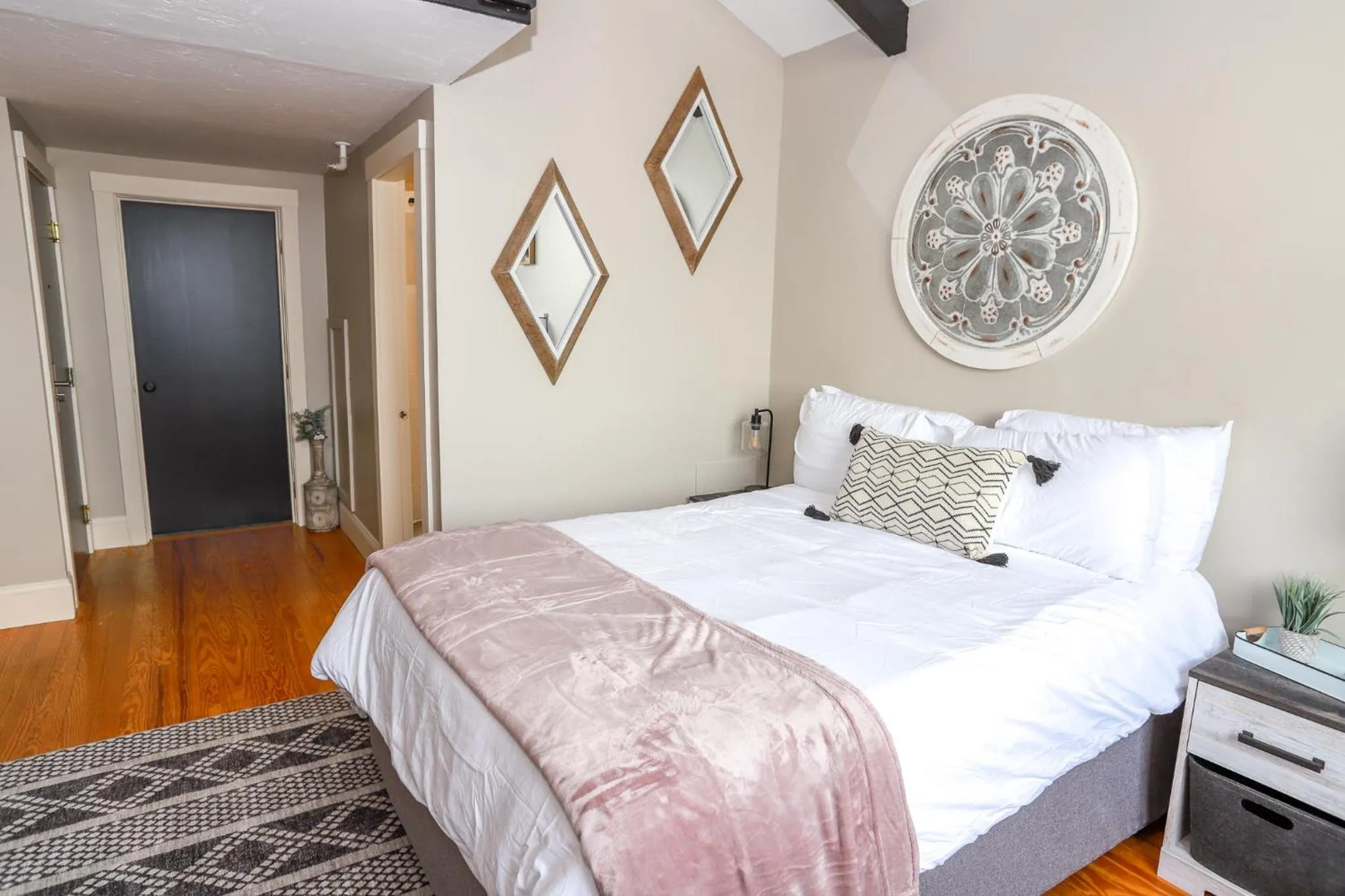 Bed in Gunstock Inn & Suites