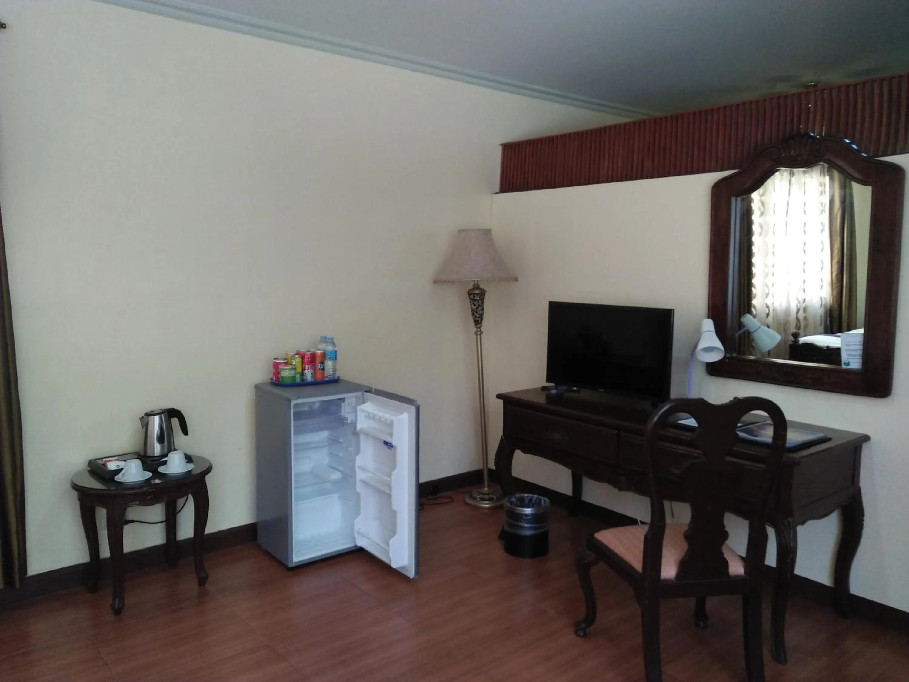 Communal lounge/ TV room in Crown Royale Hotel