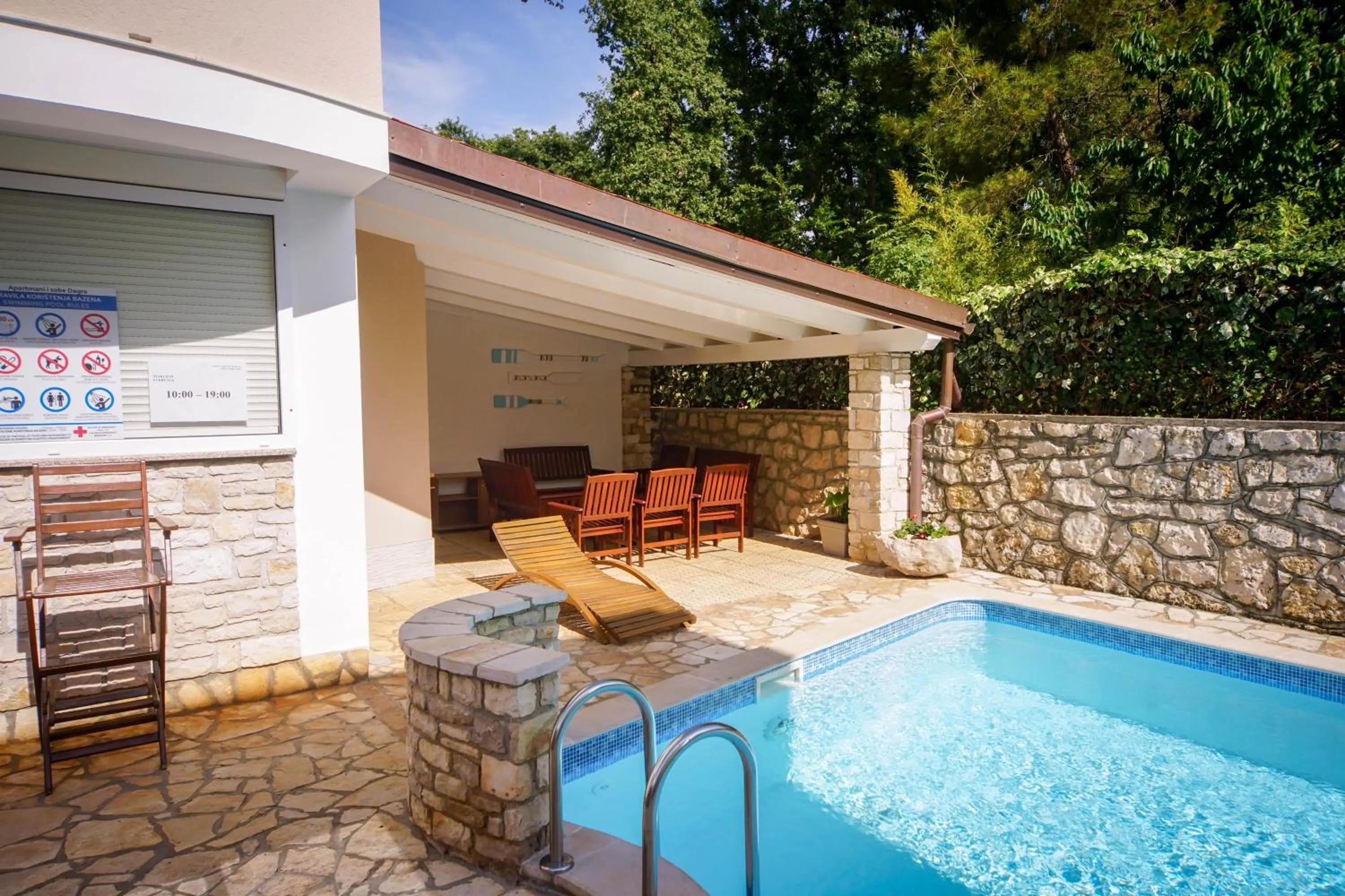 Swimming pool in Apartments and Rooms Degra