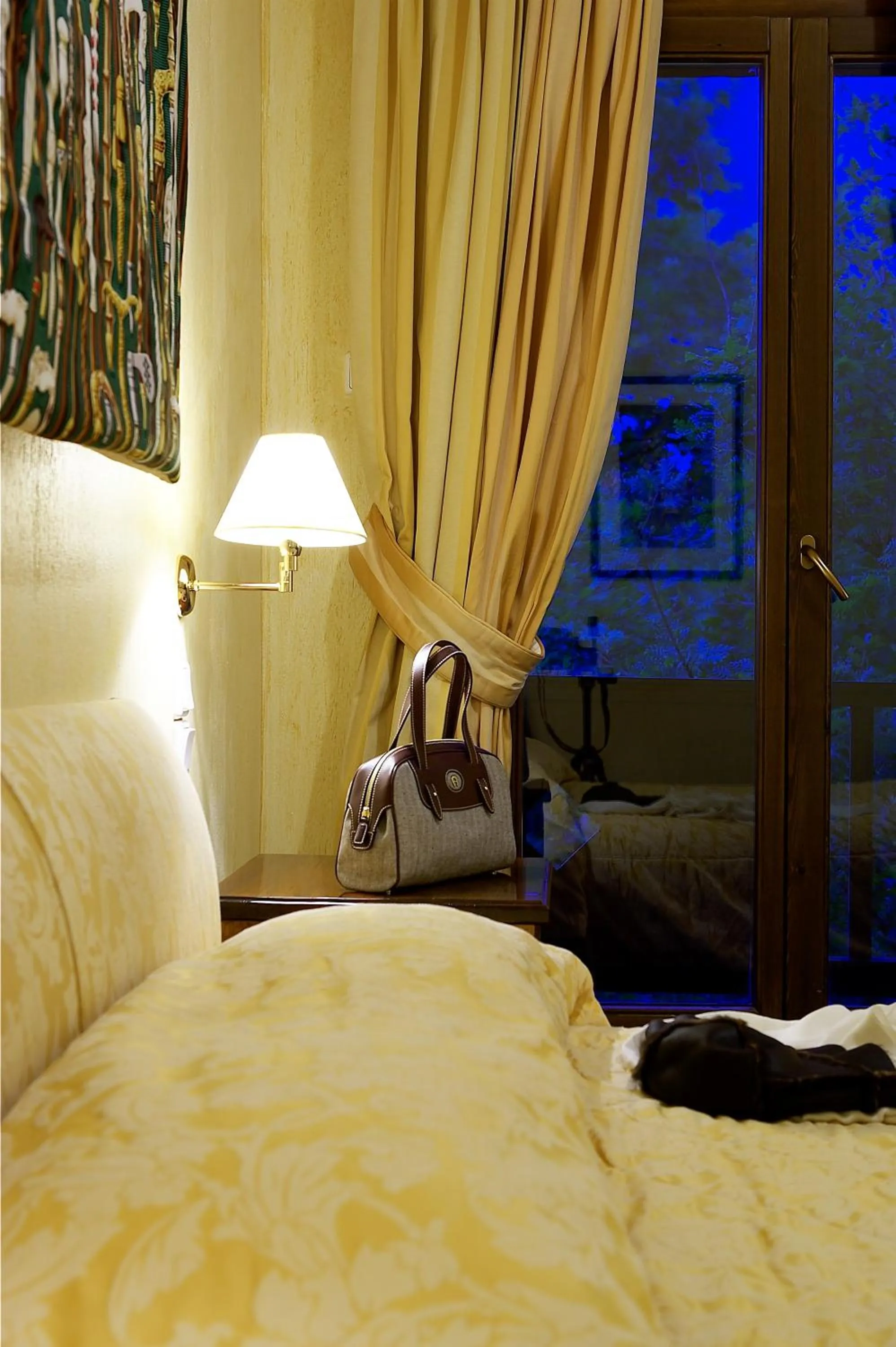 Bed in Country Club Hotel & Suites