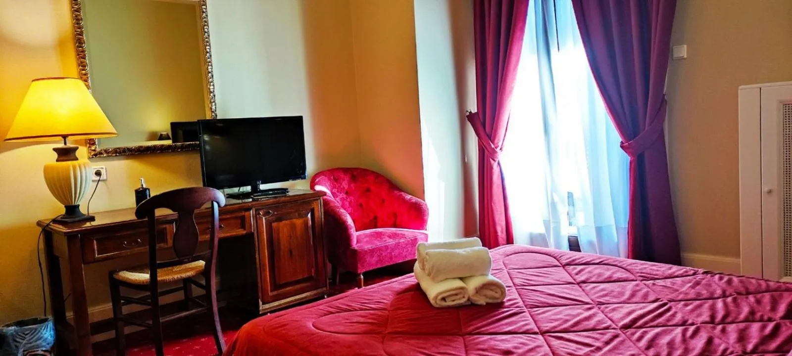 Bed in Country Club Hotel & Suites