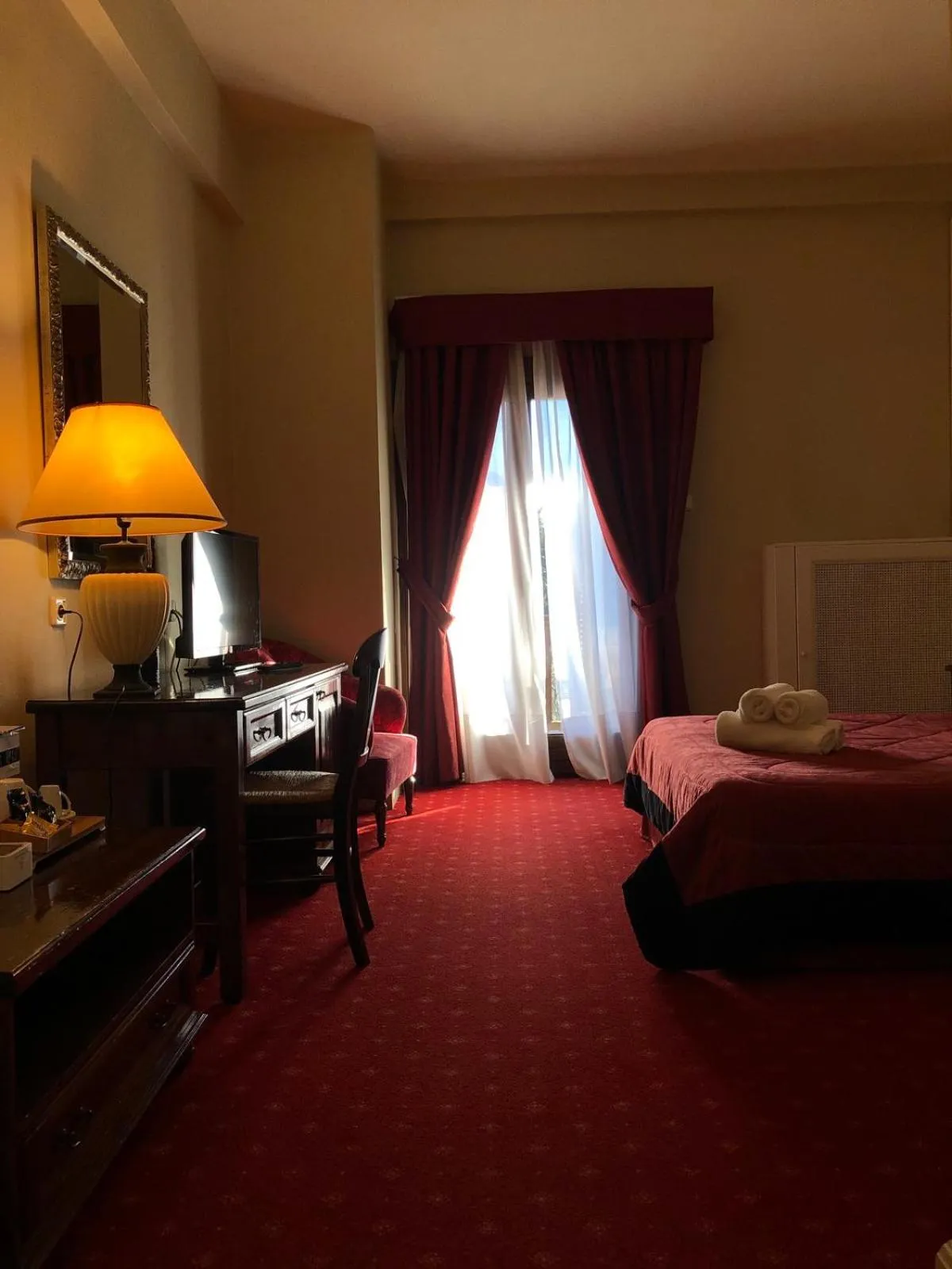 Bed in Country Club Hotel & Suites