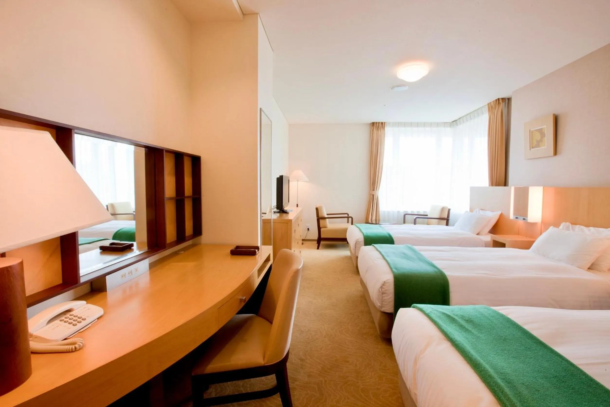 Bed in Hotel Kitano Plaza Rokkoso