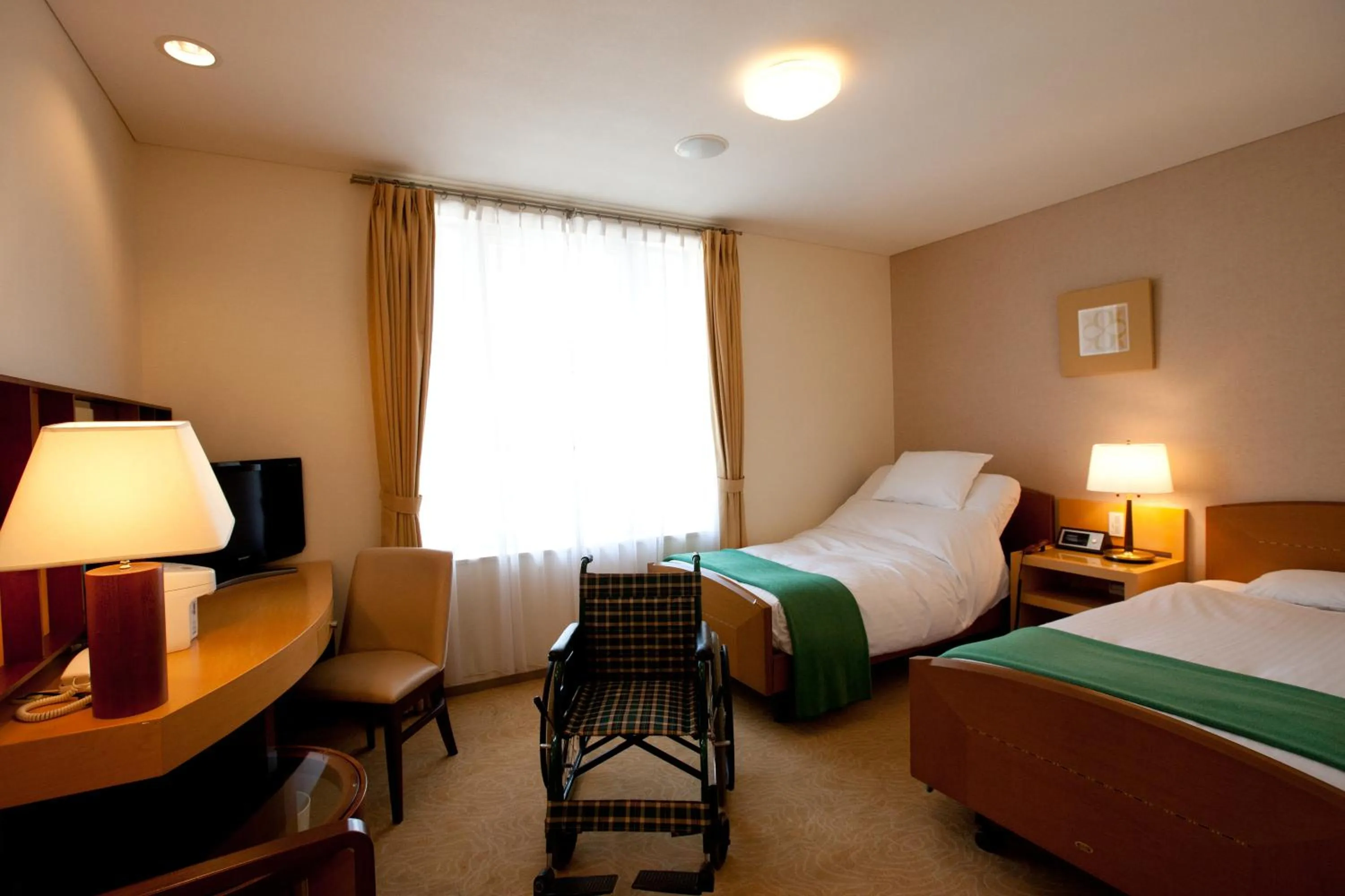 Bed in Hotel Kitano Plaza Rokkoso