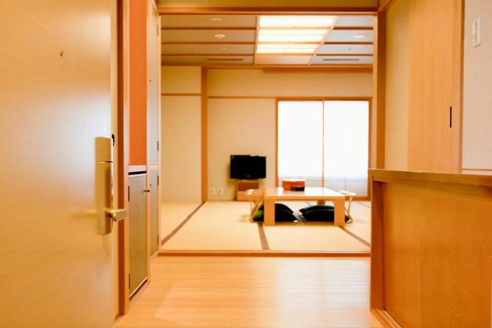 Photo of the whole room, Bed in Hotel Kitano Plaza Rokkoso