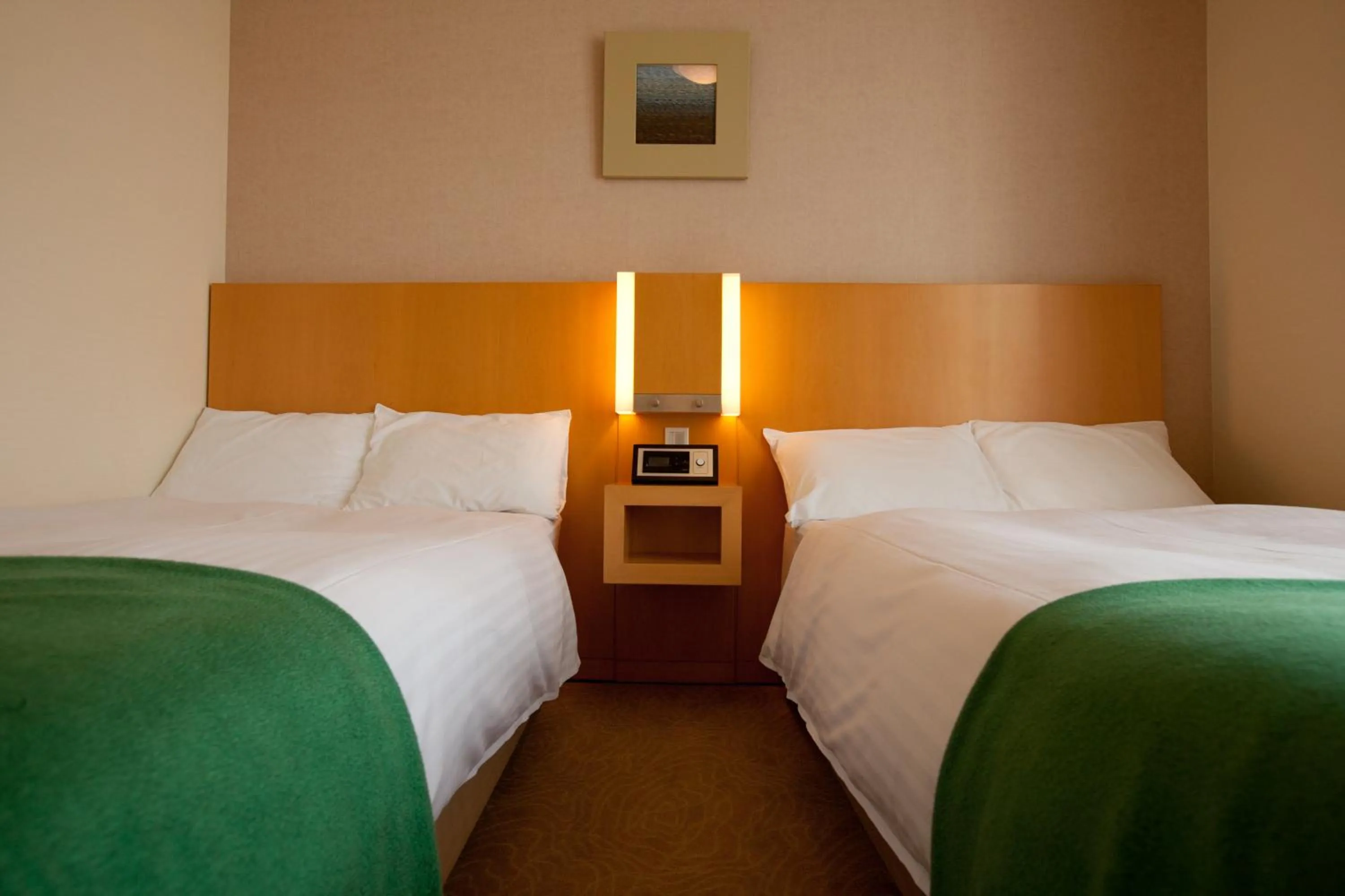 Bed in Hotel Kitano Plaza Rokkoso